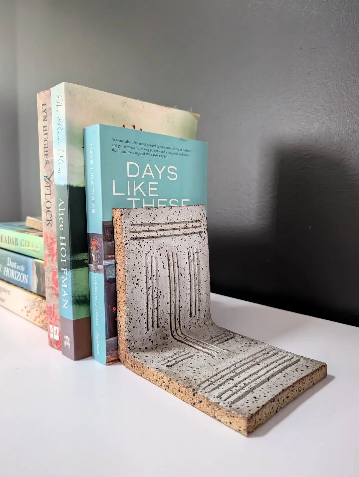 BOOKENDS - my experimental ceramic bookends are finally finished and I'm happy to say this idea has potential.

This set is mine to keep as there is lots of room to improve with the execution. I got impatient with the drying process resulting in slig
