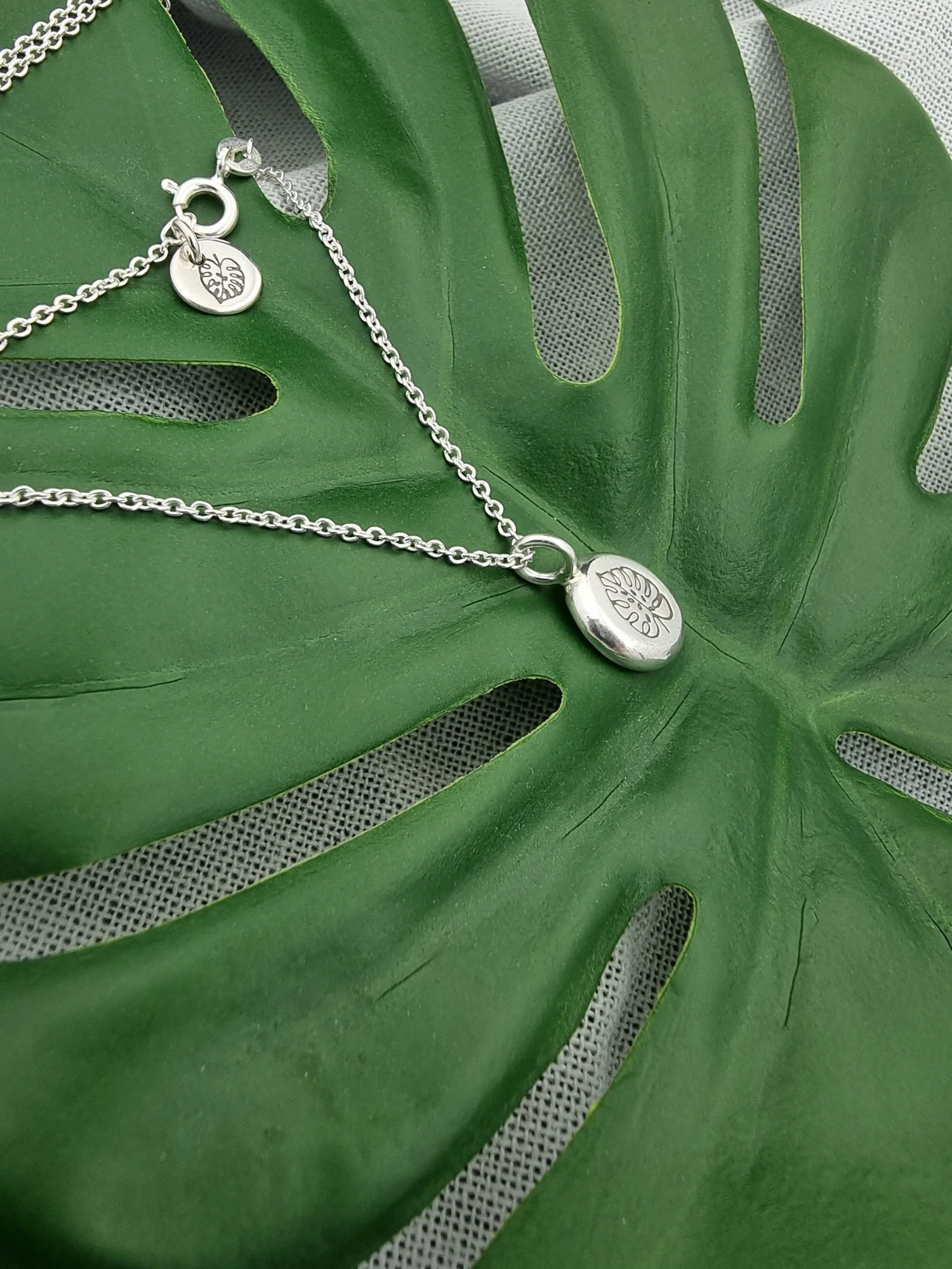 recycled-silver-monstera-necklace (1).jpg