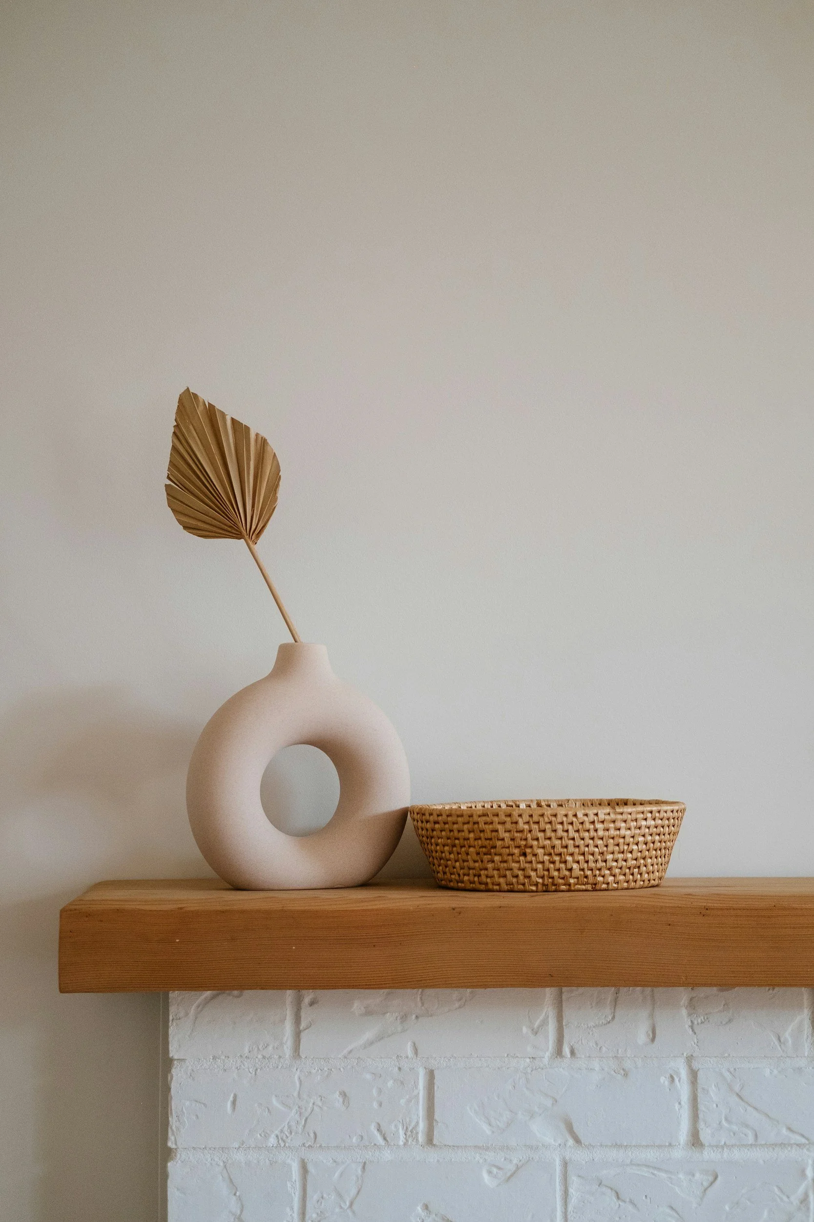Boho vase and weaved basket on mantal