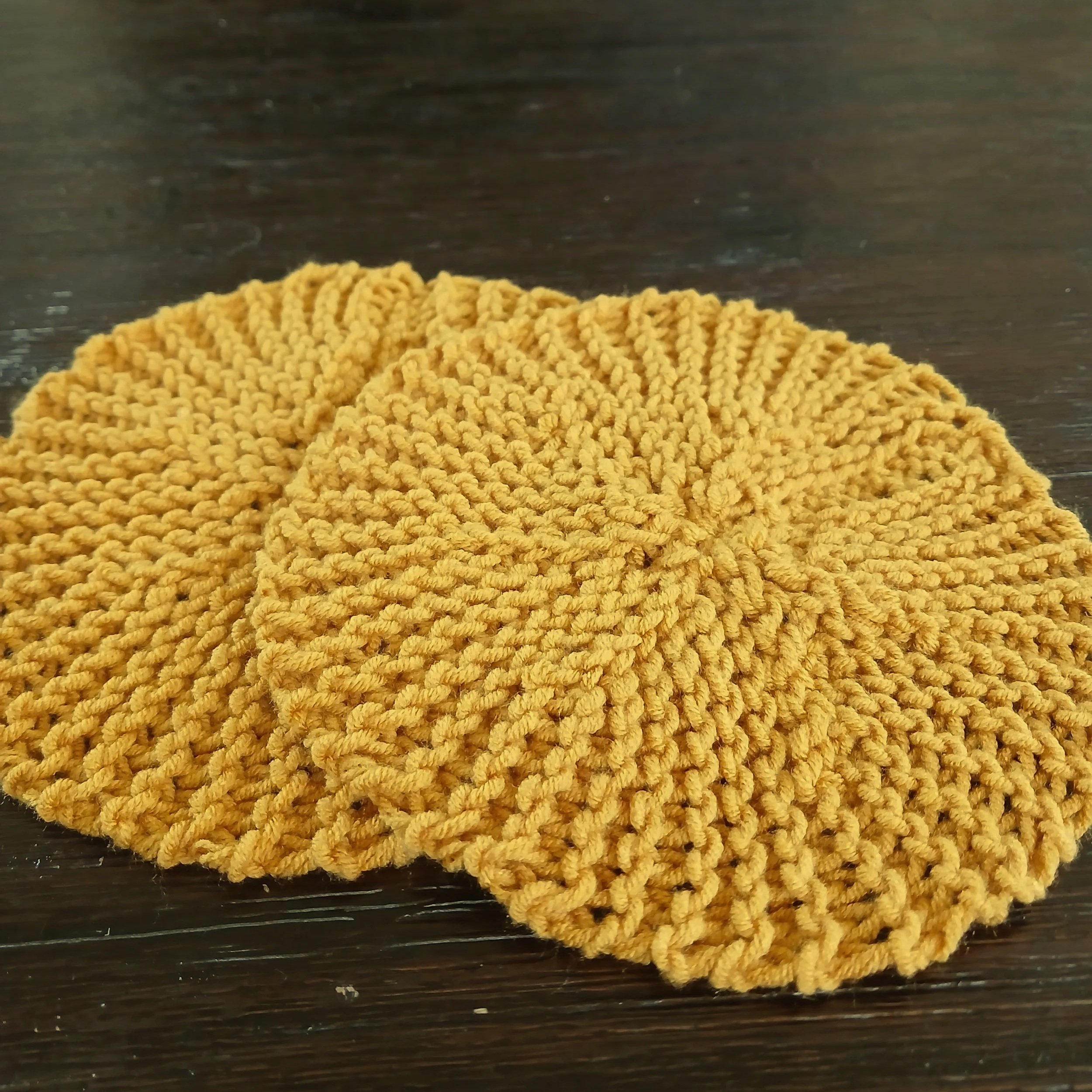Hand-knitted sunburst decor pair