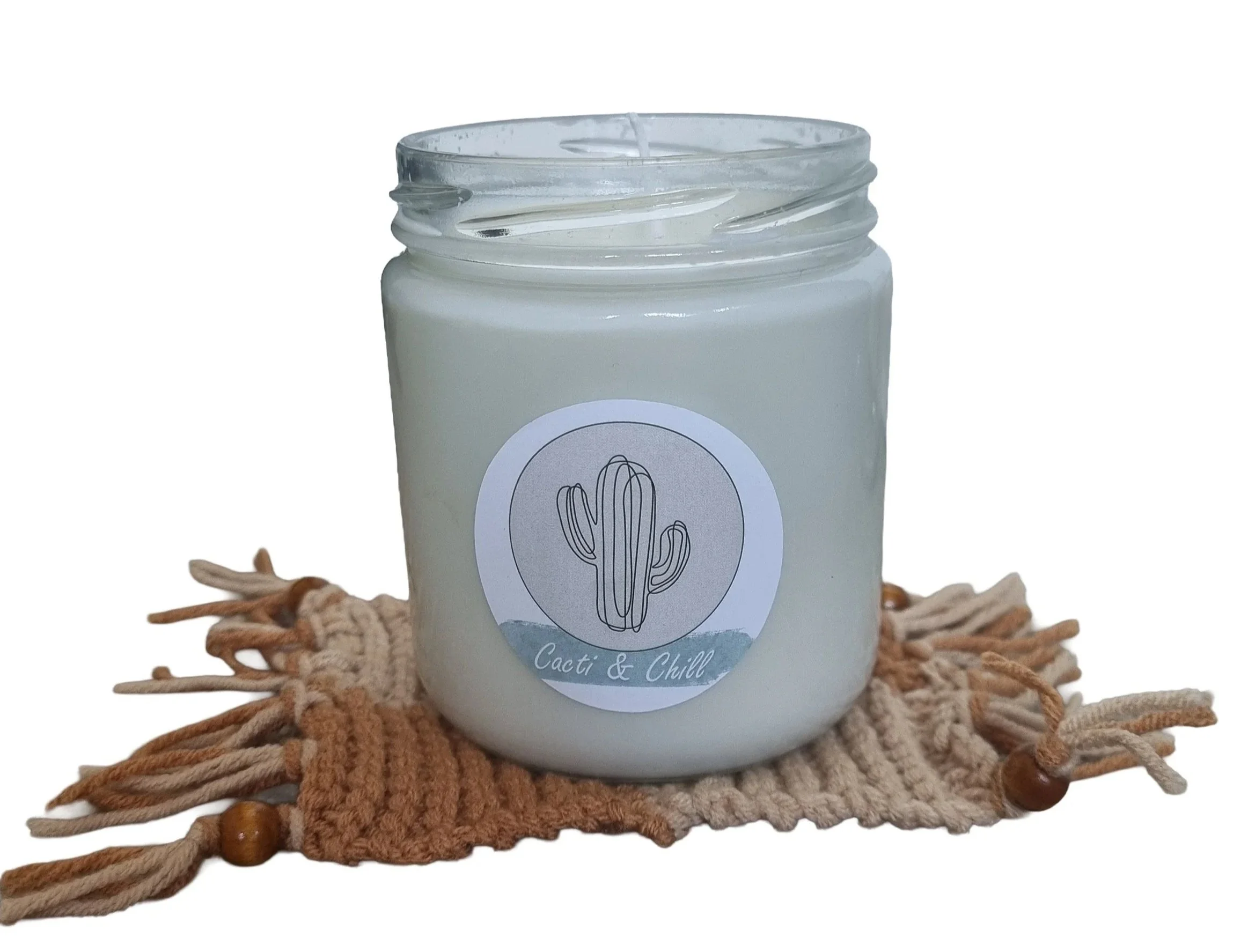 Coconut and Vanilla scented candle hand poured into a recycled glass jar, simple and stylish