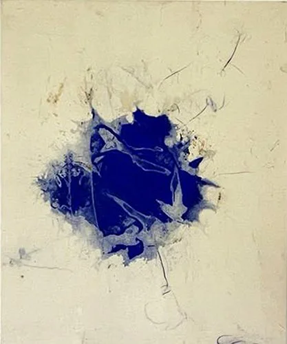 A large dark blue paint splatter on a light-colored wall with cracks and streaks.