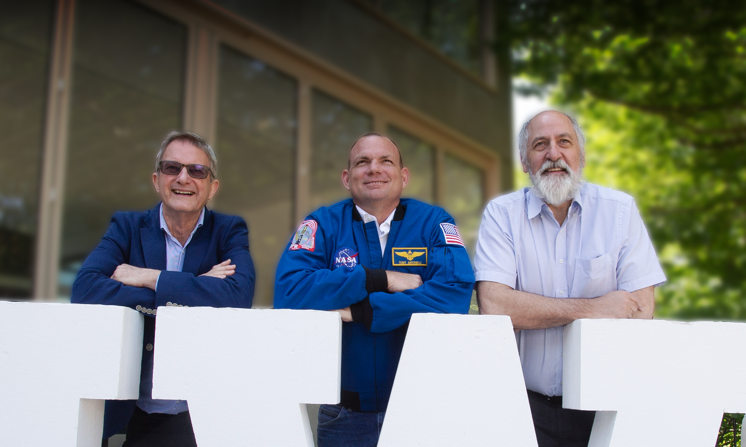 Astronaut Tony Antonelli and Astronaut Leadership Director Chris Barber guiding a university principal through a NASA‑Style Simulation leadership exercise.