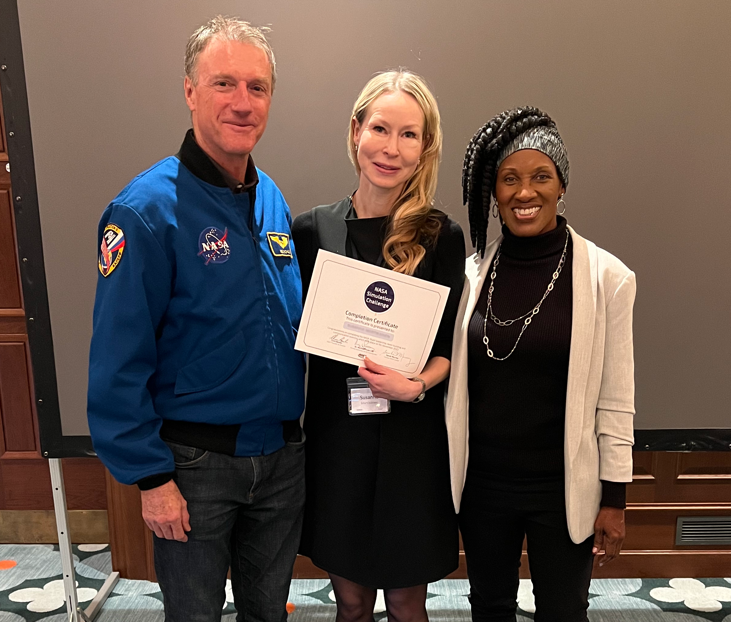 Astronaut-Michael-Foale & NASA-Leader-Sarah-Murray with participant-on-the-nasa-style-simulation-leadership-programme.png
