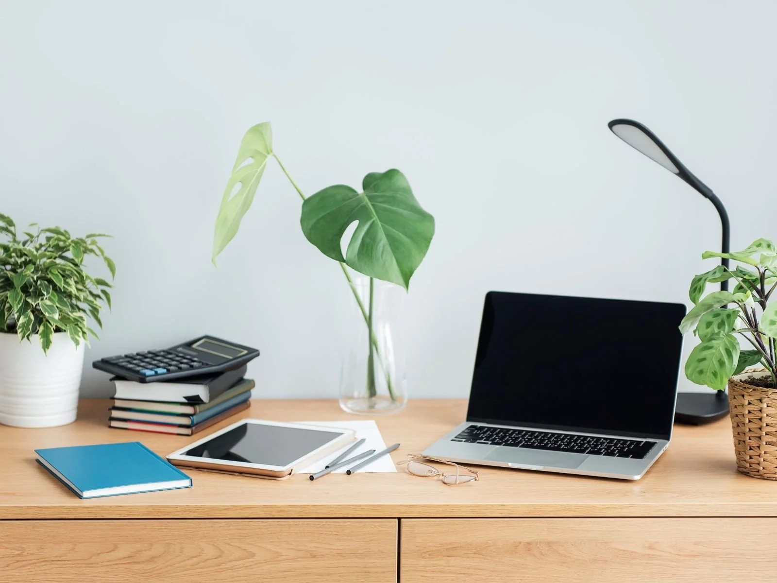 minimal teal sage home office wooden desk laptop natural light