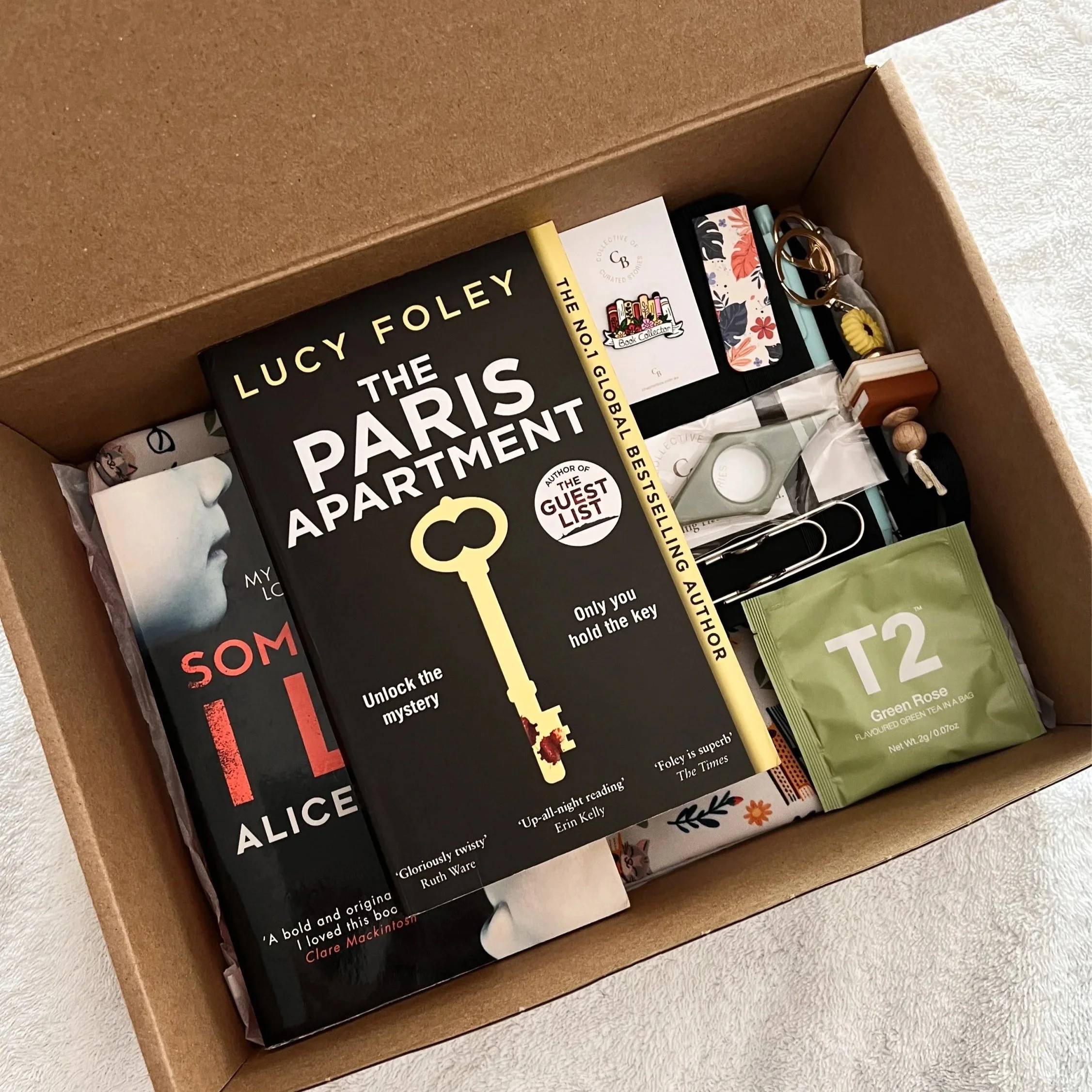 Book+box+with+2+books%2C+tea%2C+pin%2C+page+holder%2C+keyring+and+book+sleeve.jpg