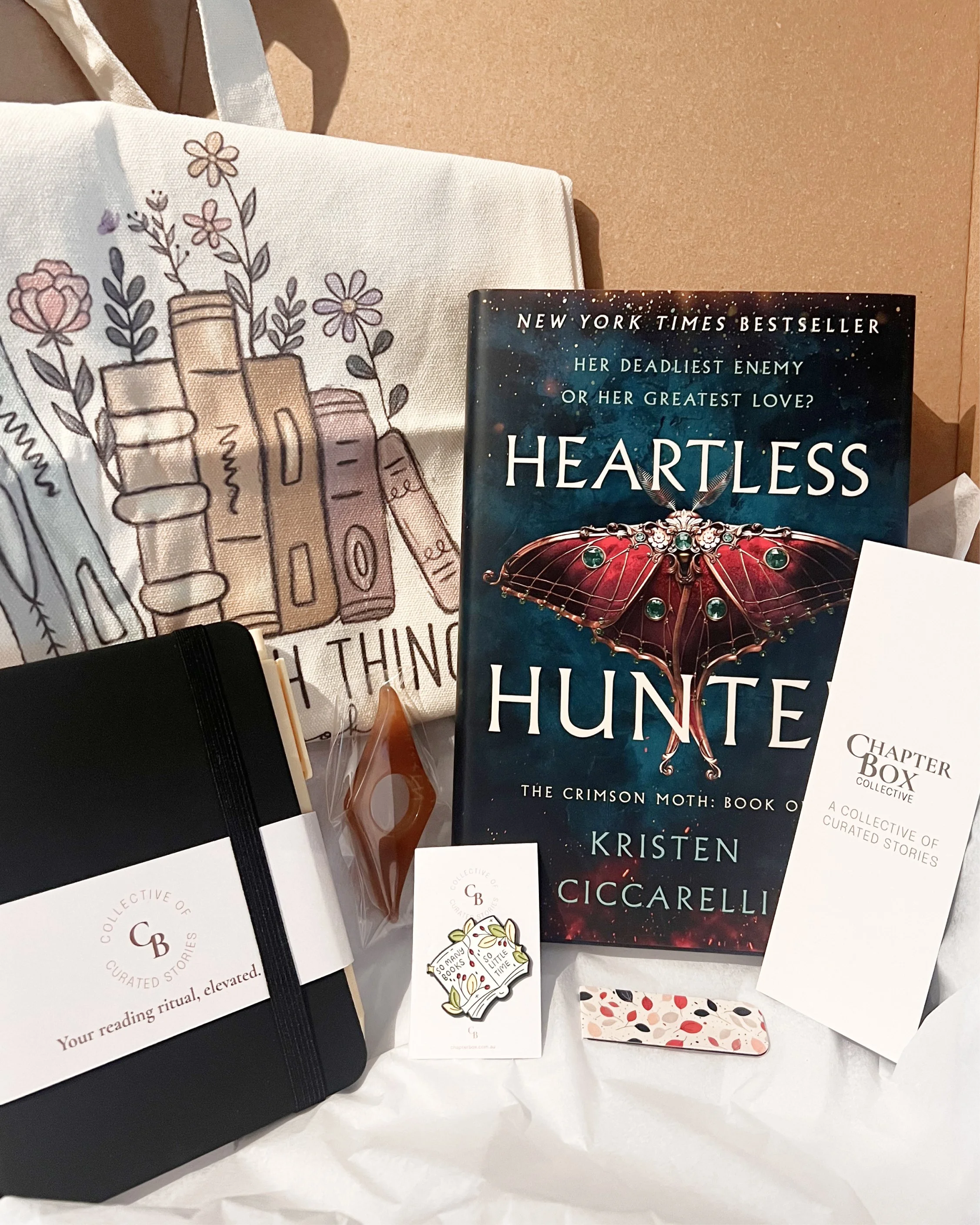 Book box with book, tote bag, notebook, pin and bookmark