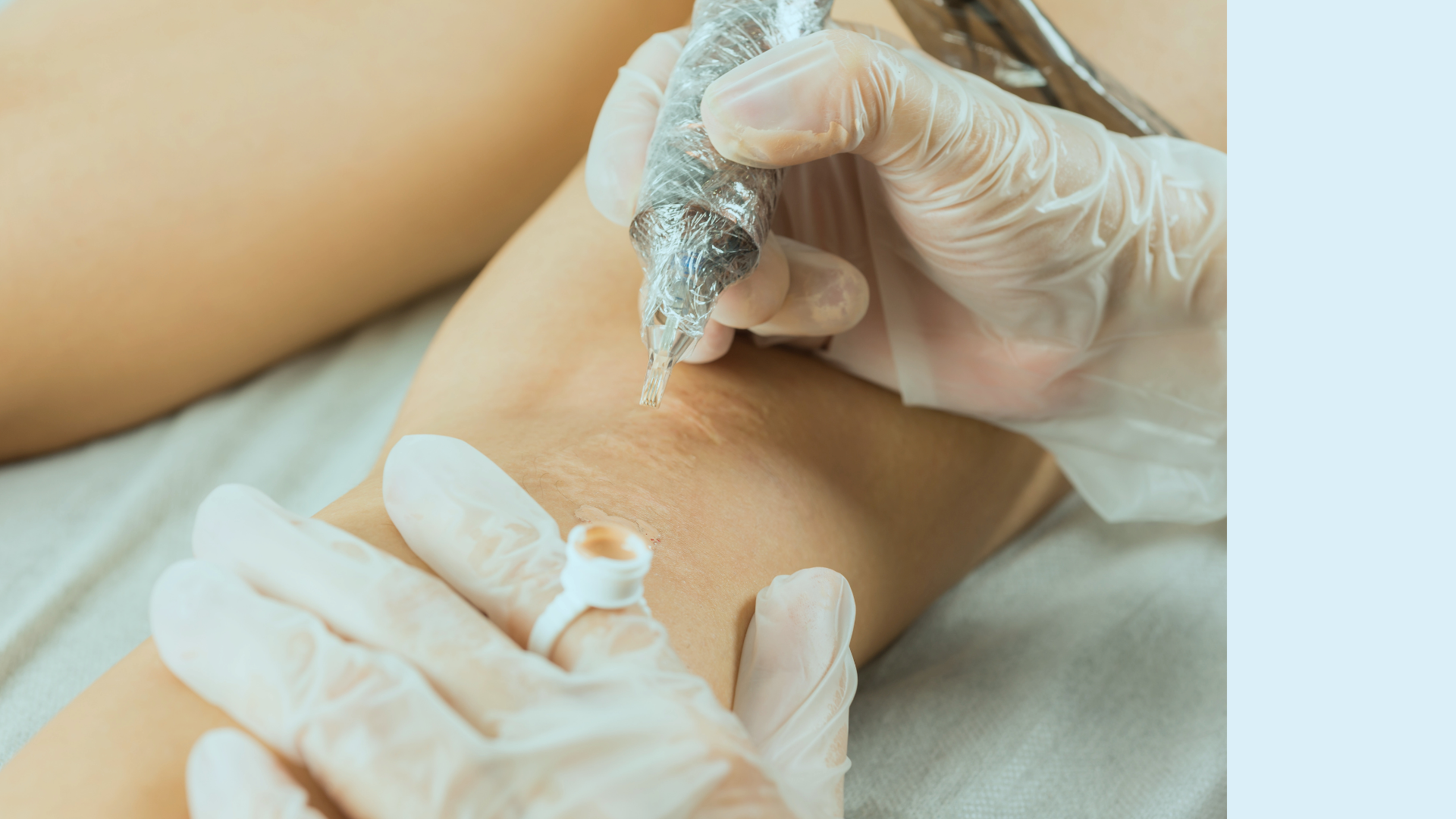 A person wears latex gloves and has his forearm tattooed with a tattoo machine.