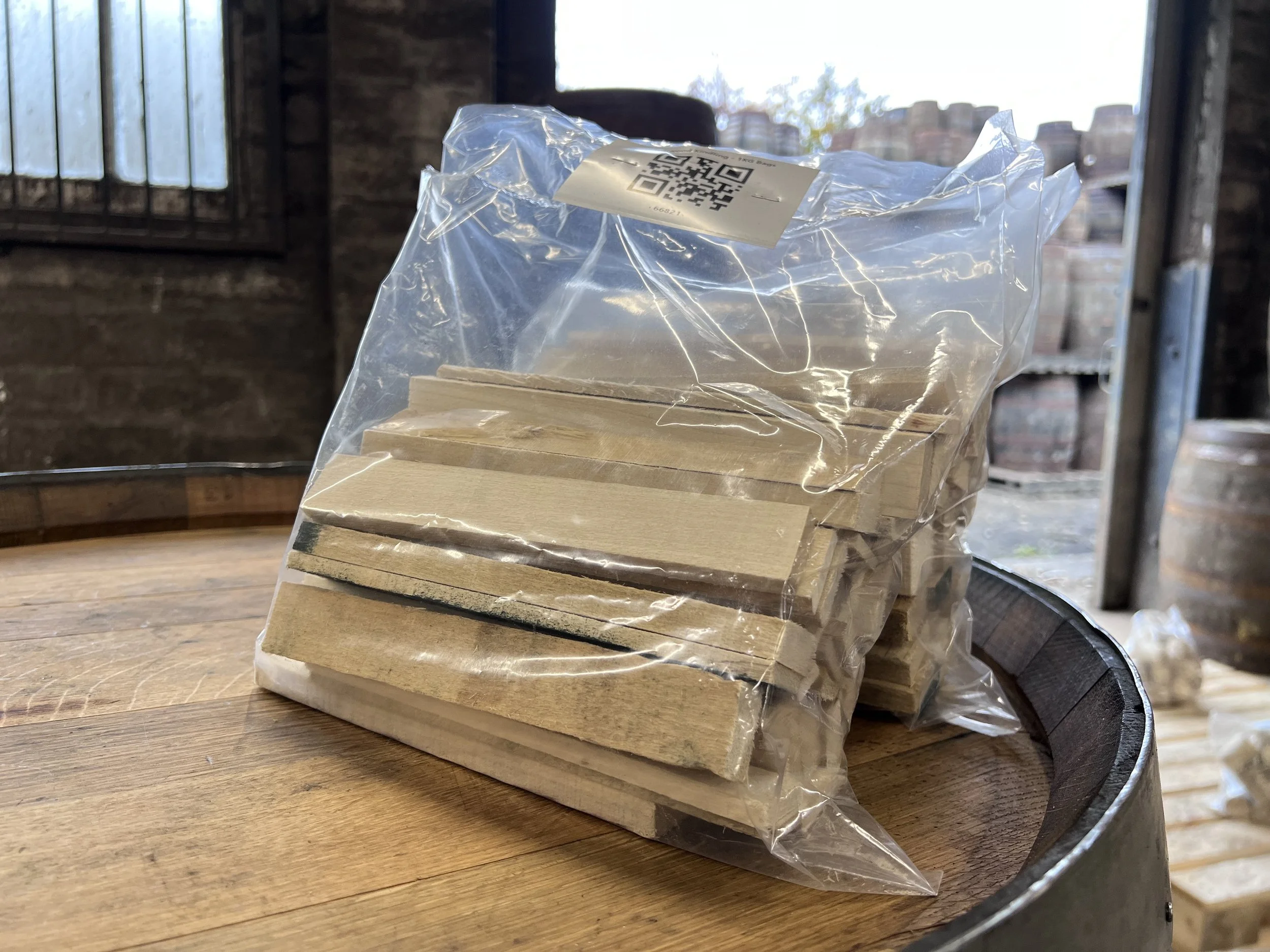 Kindling in a small plastic bag sitting on top of cask