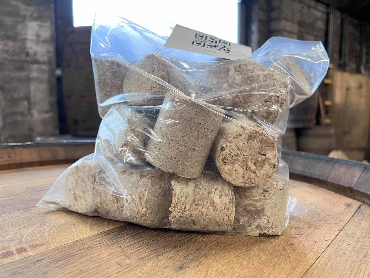 A large pile of small, wooden briquettes ready to be used for firewood.