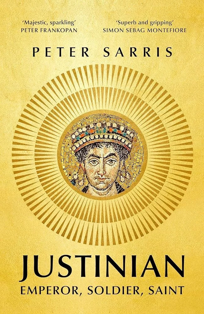 Book cover for 'Justinian: Emperor, Soldier, Saint' by Peter Sarris, featuring a mosaic portrait of Emperor Justinian with a halo, on a gold background.