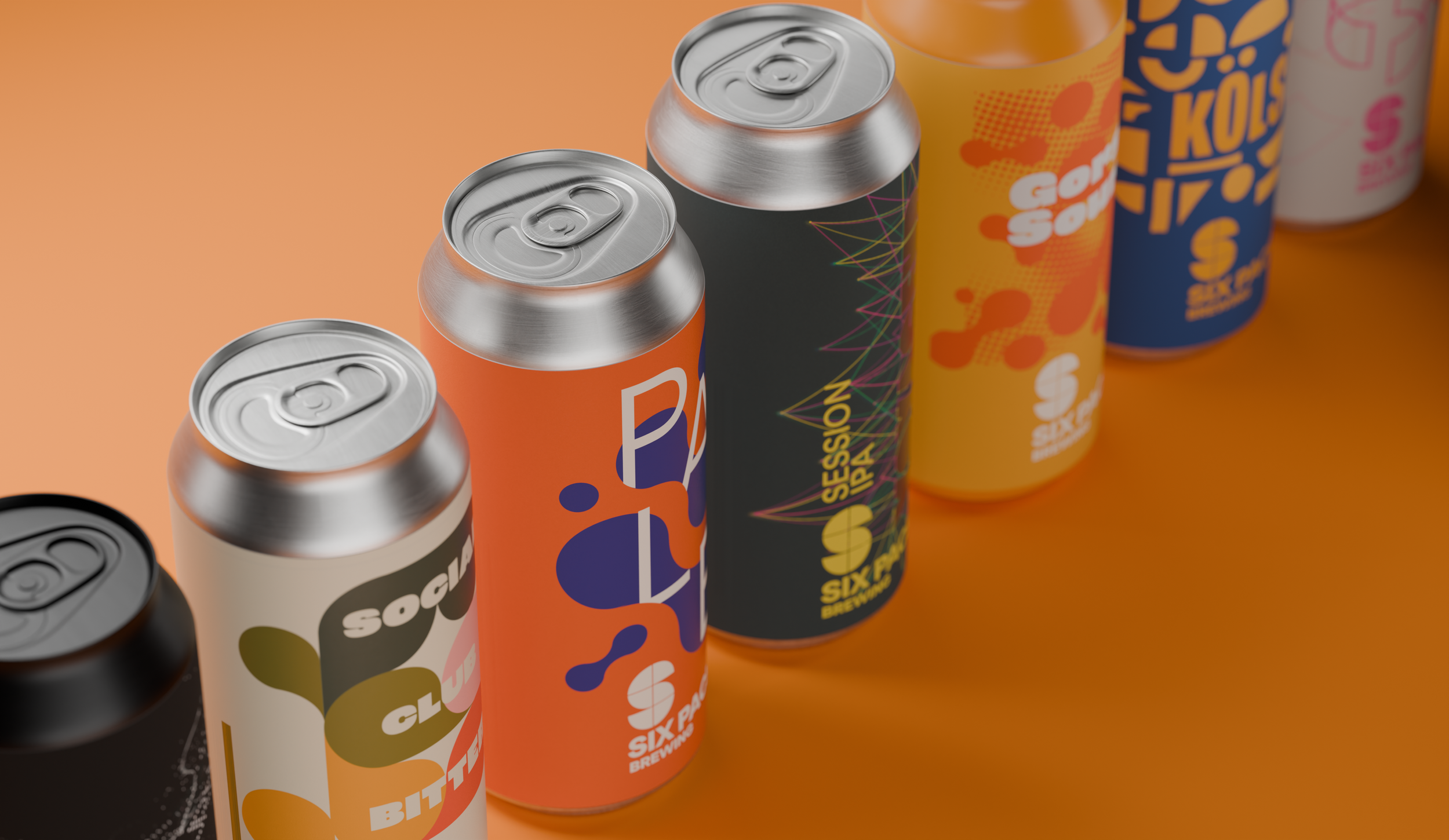 Several colorful cans of soft drinks or energy drinks placed on an orange surface.