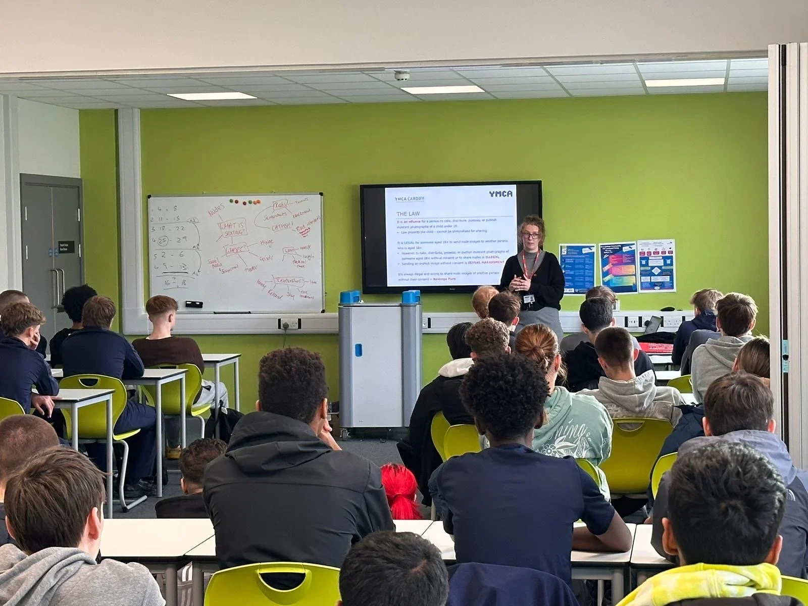 Sarah Peart delivering a sex education workshop to school students in a classroom