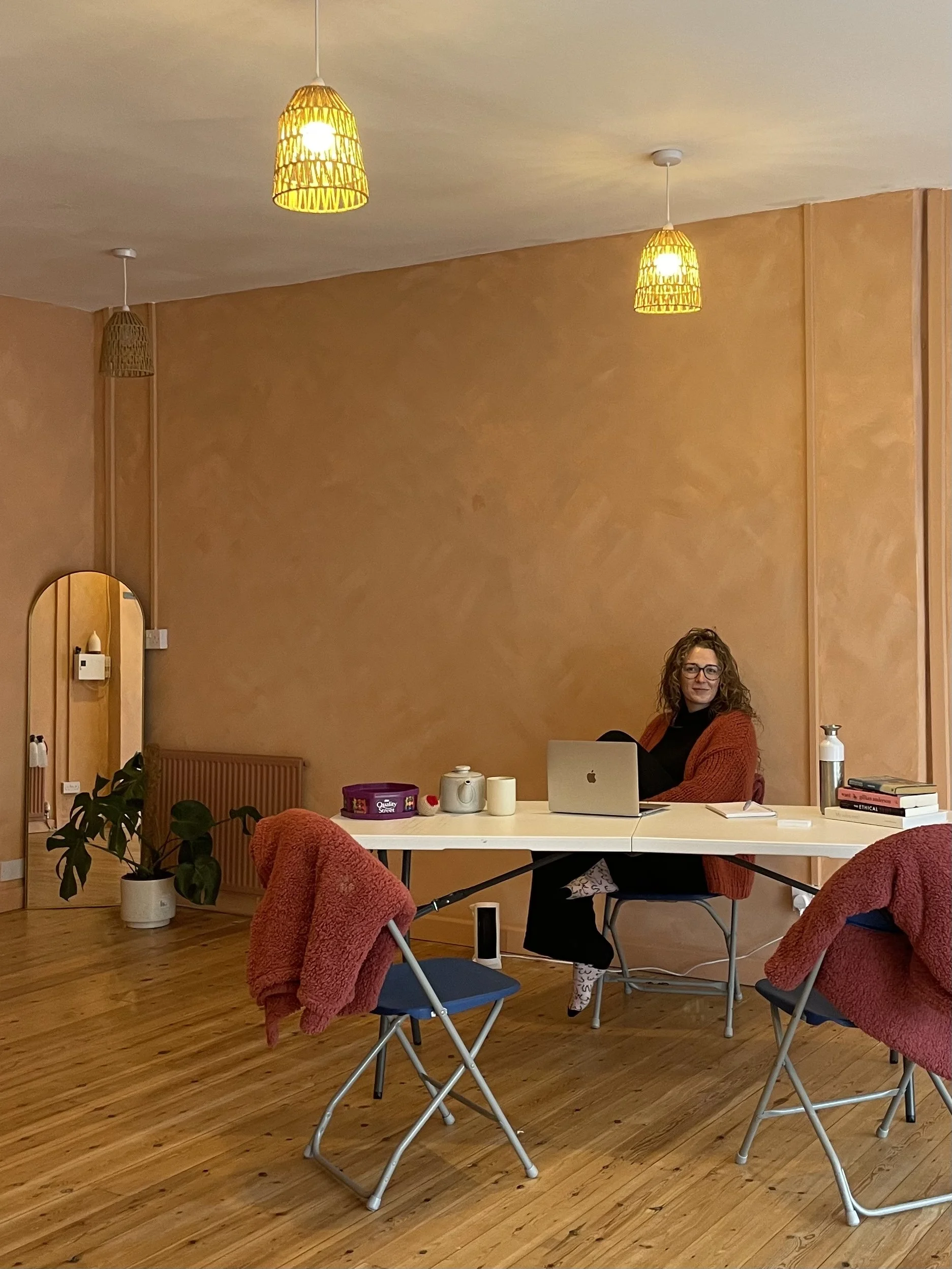 Sarah Peart Brisbane sex therapist seated in a warm, welcoming therapy room