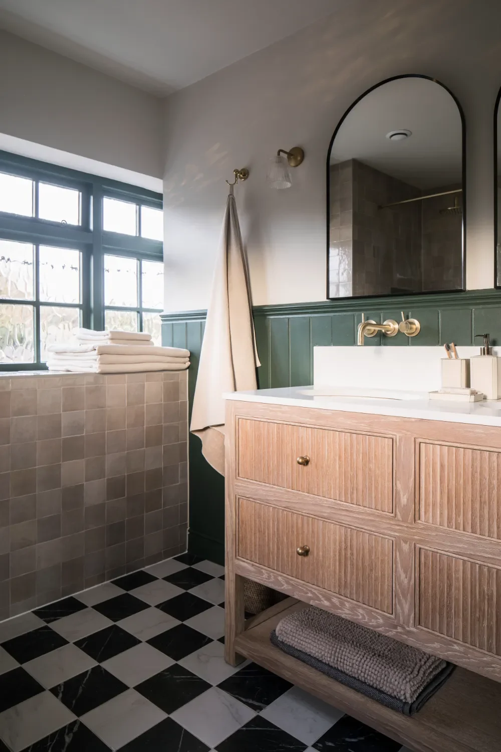 double-vanity-with-green-paneling-interior-design-kent-michelle-shakallis.webp