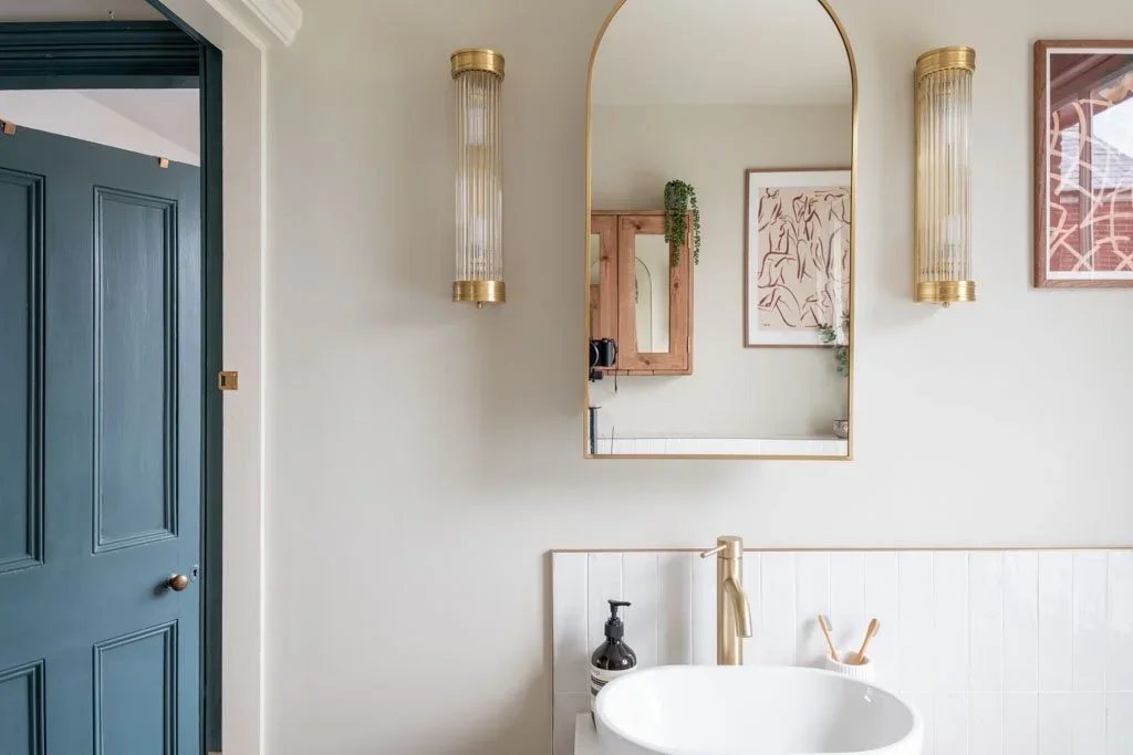 bathroom+vanity+with+blue+door.webp