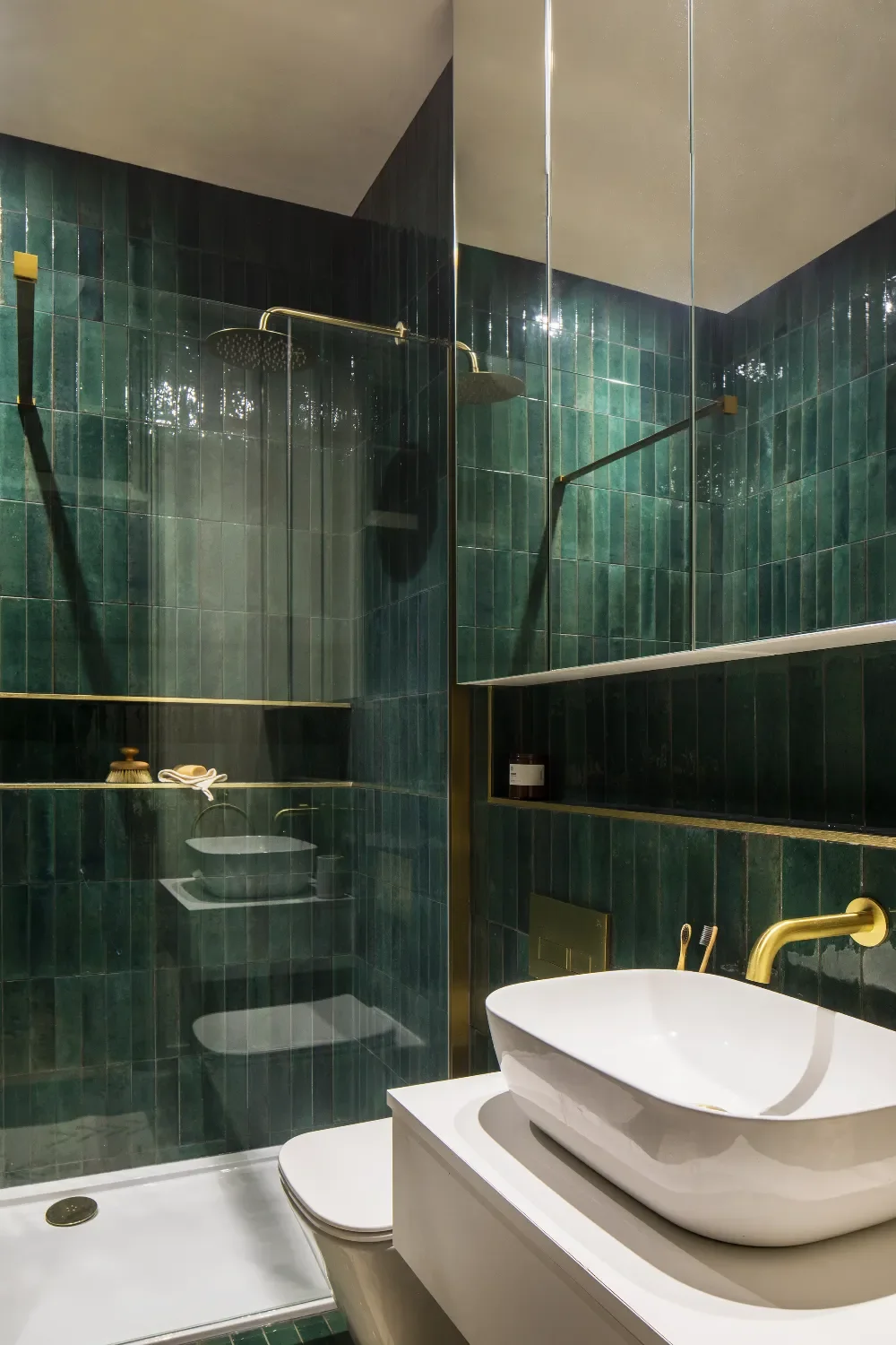green-tile-shower-room-with-mirror-cabinets-interior-design-kent-michelle-shakallis.webp
