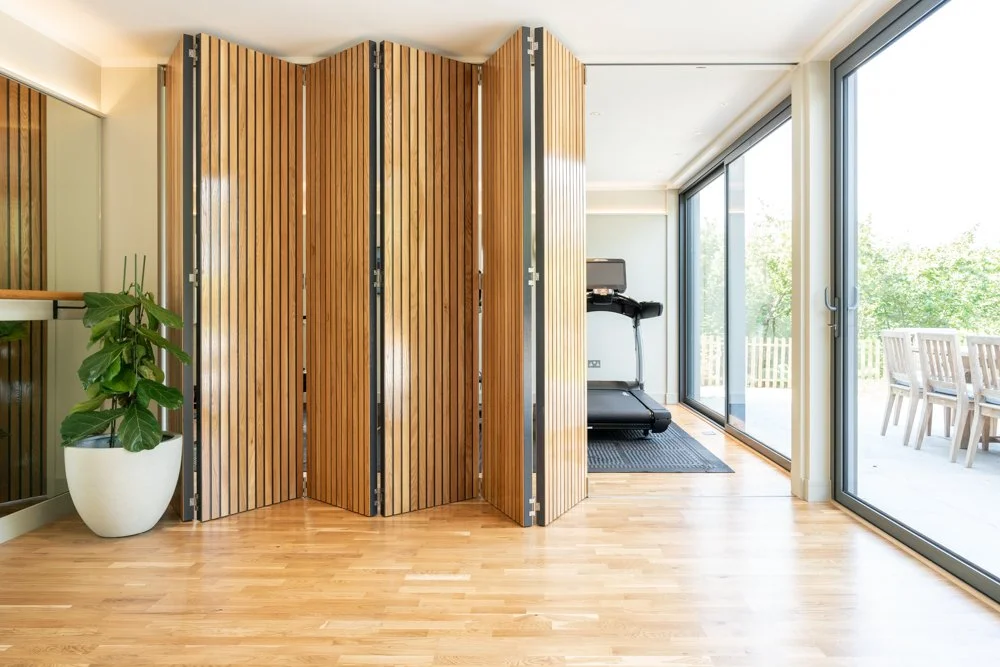 Bifold wall in a gym Michelle Hakallis Interiors.jpg