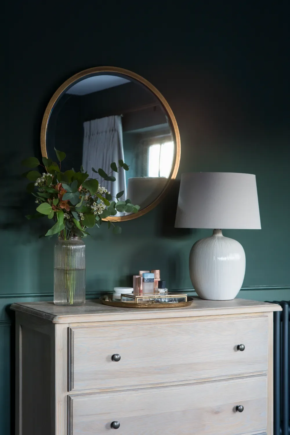 dark-green-bedroom-with-lamp-and-mirror-interior-design-kent-michelle-shakallis.webp
