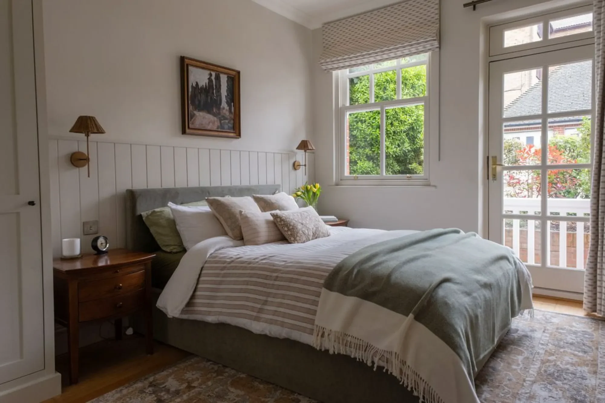 country bedroom with paneling Kent Michelle Shakallis Interiors.webp