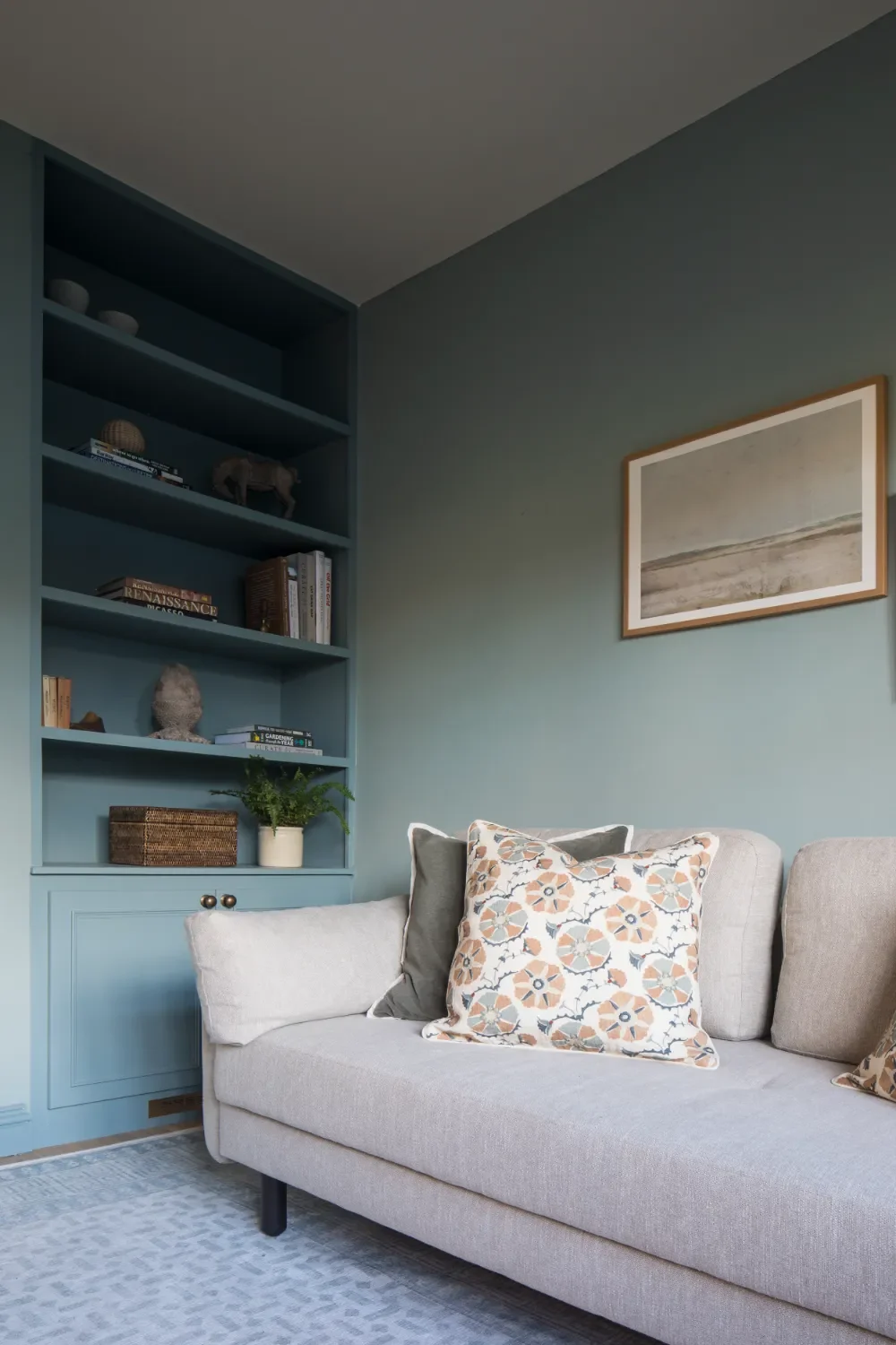 blue-shelves-and-sofa-interior-design-kent-michelle-shakallis.webp