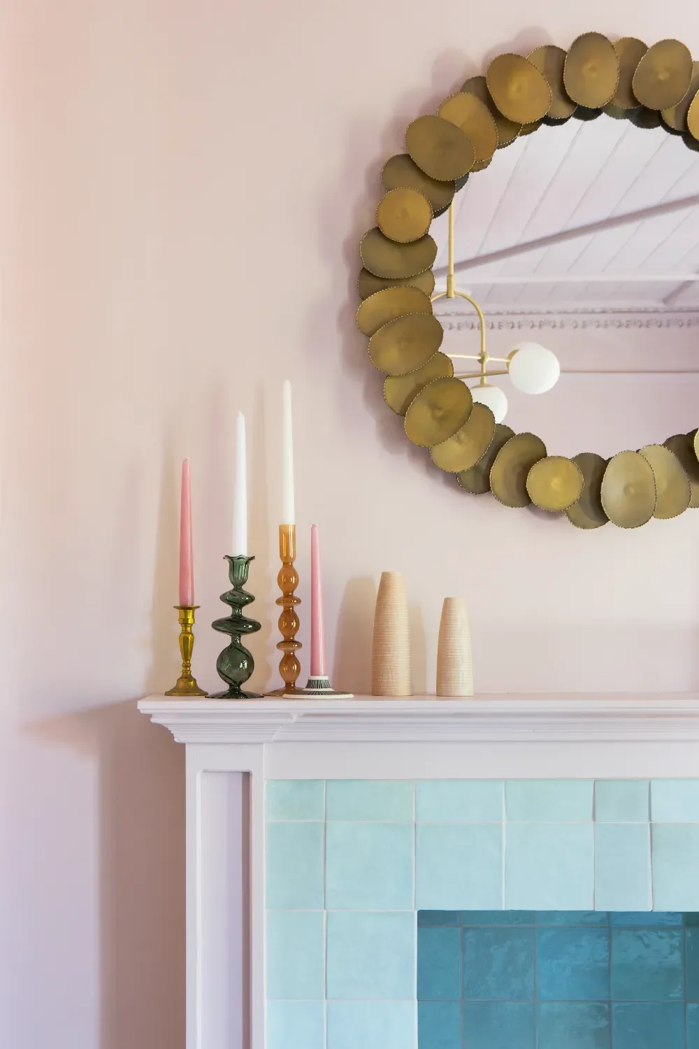 Pink-living-room-with-mirror-and-blue-fireplace-interior-design-kent-michelle-shakallis.webp