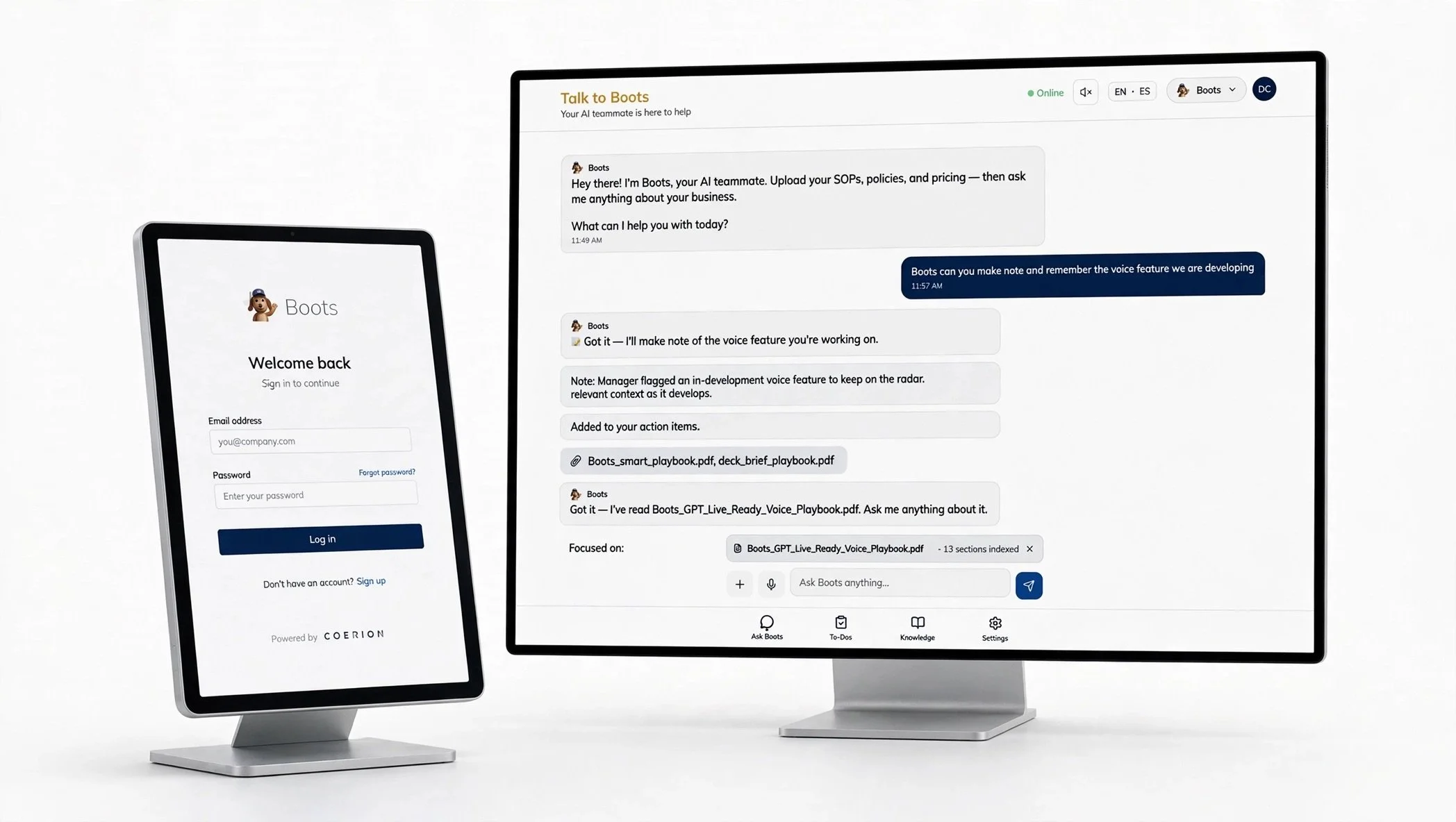 A computer monitor and a smartphone displaying a chatbot interface named "Boots" with conversation and login screen, situated on a white desk.