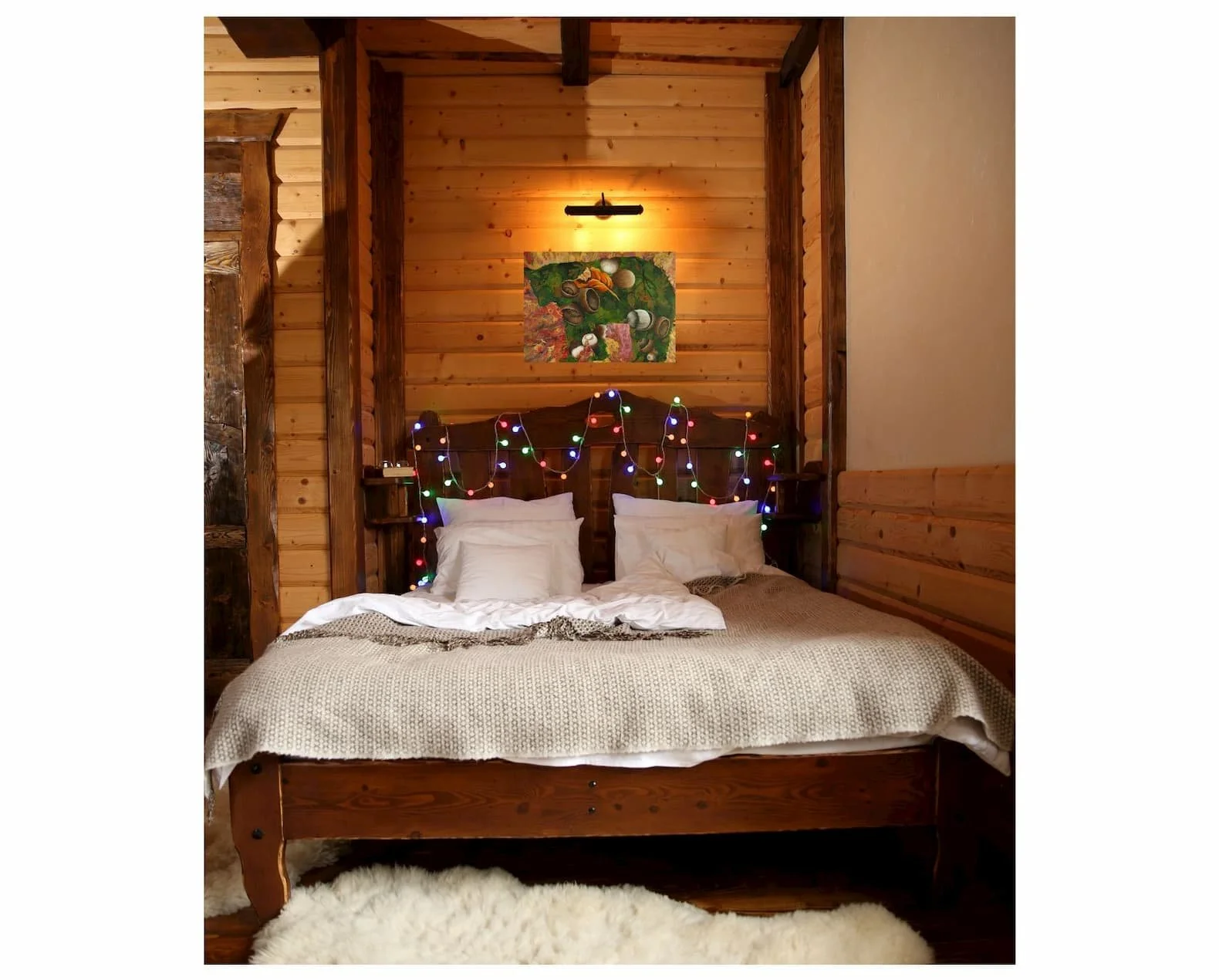 The artwork hanging in a cozy wood-paneled bedroom showing how the bear silhouette and fall colors add warmth to the space.