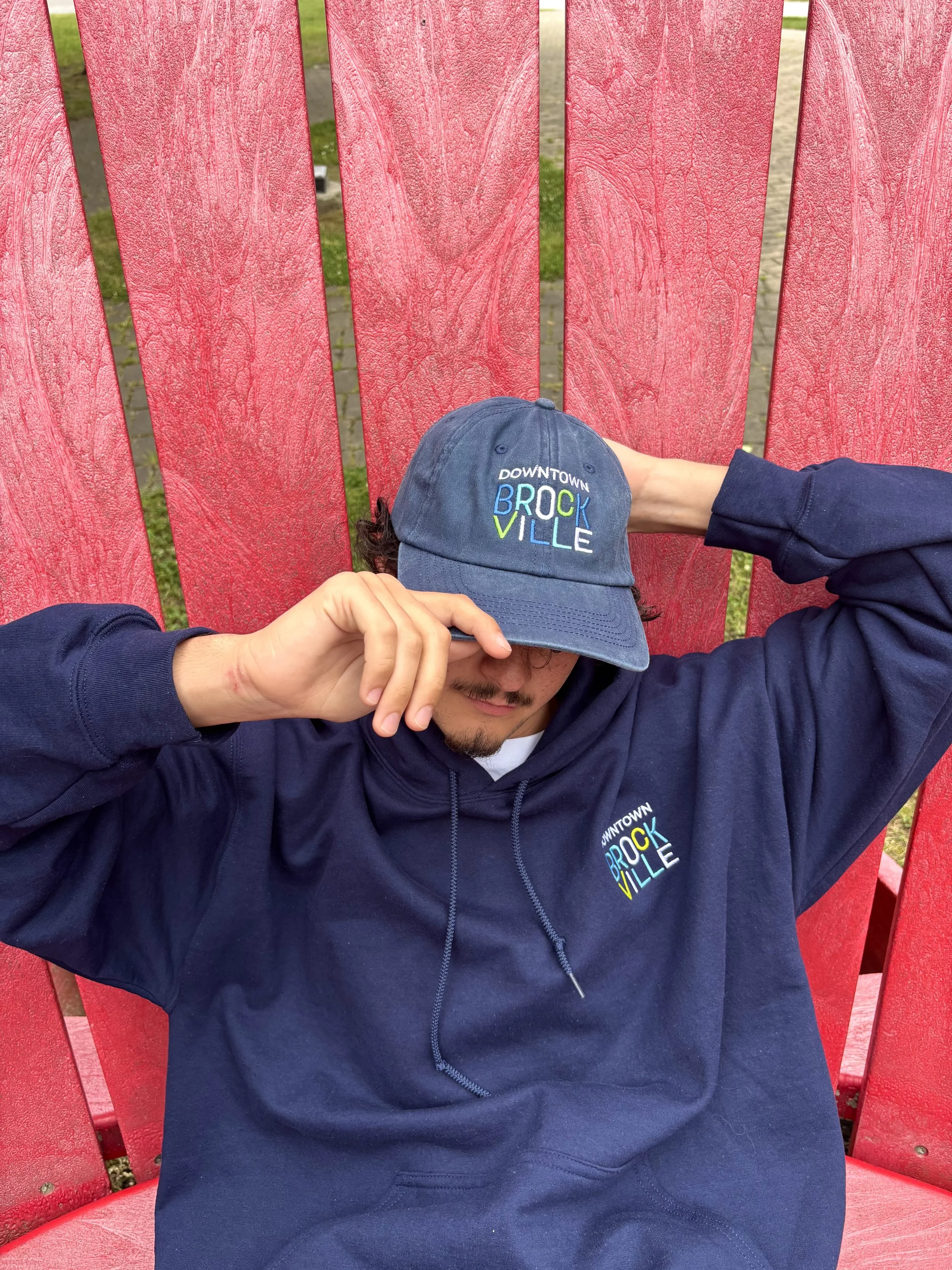 Blue Sweater & Hat Red Chair.jpg