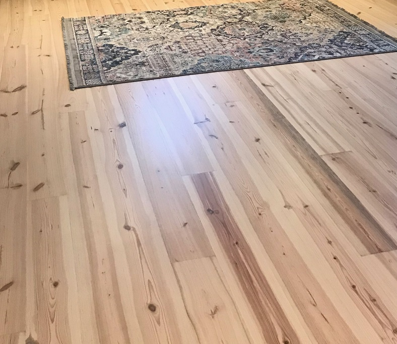 Caribbean Heart Pine flooring room with rug.png