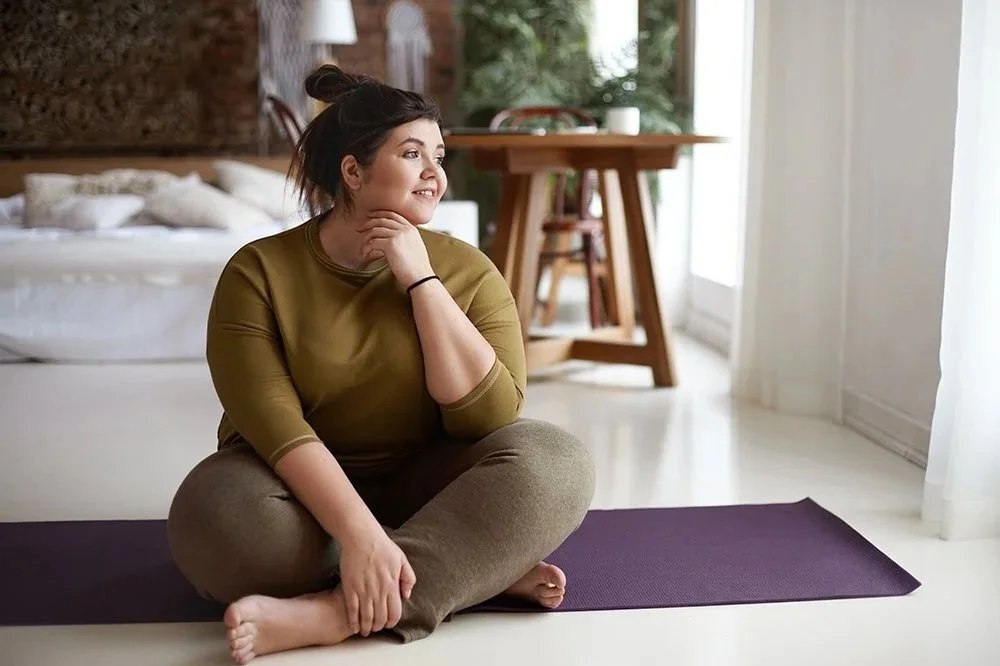 NovaFit telehealth young healthy woman on yoga mat