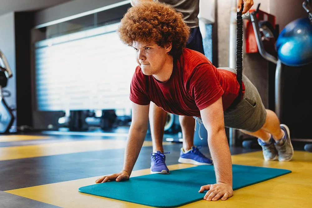 NovaFit young adult doing a push up