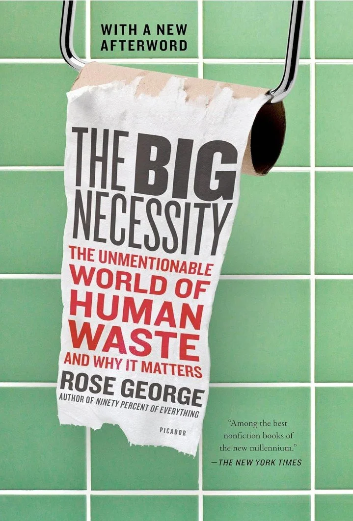 Scenic landscape of mountains, a lake, and rolling hills with cloudy sky.