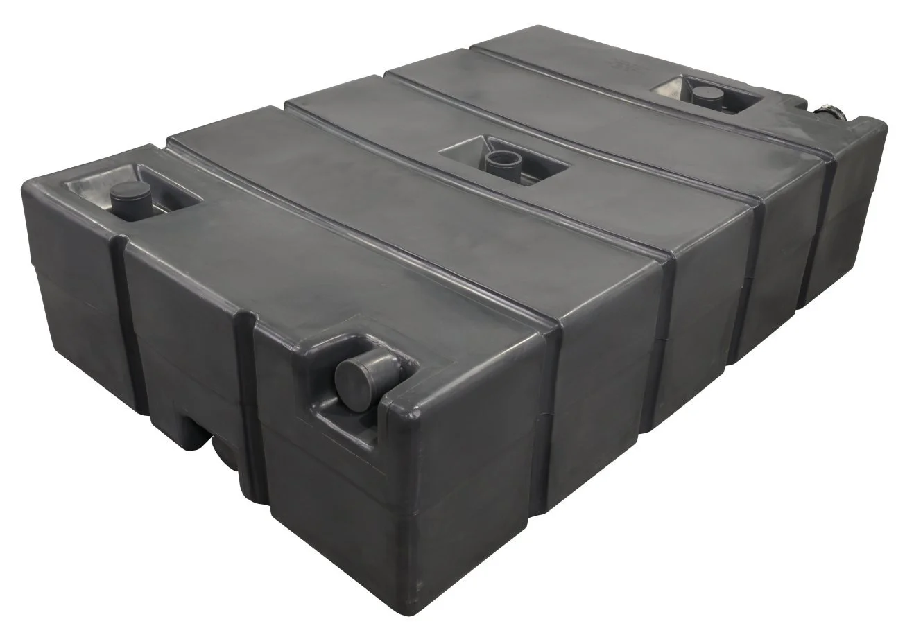 A large black plastic water storage tank with multiple sections and connectors.