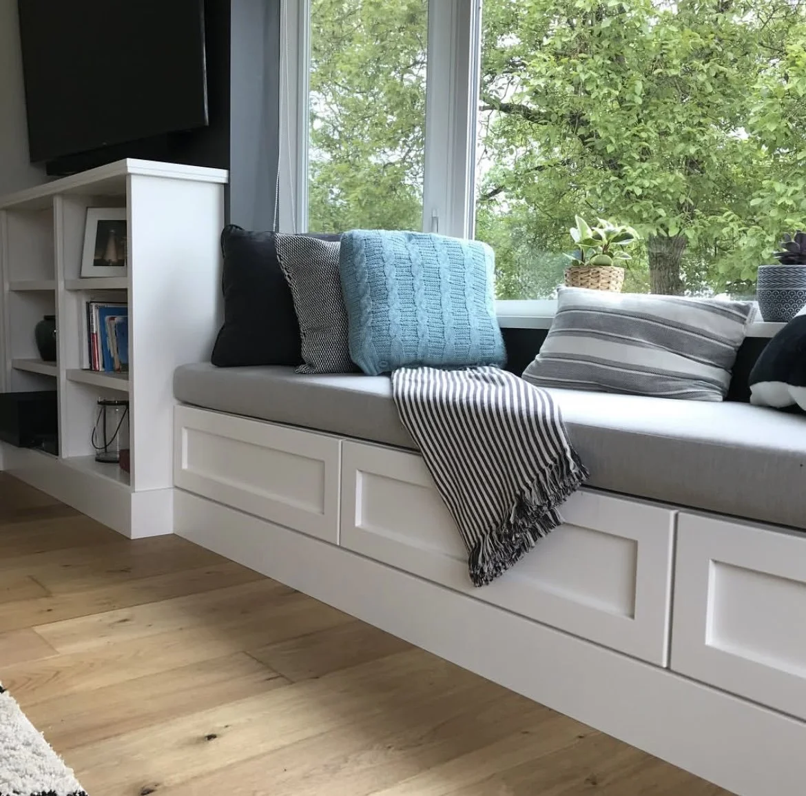 A custom accent piece reading nook window seat millwork