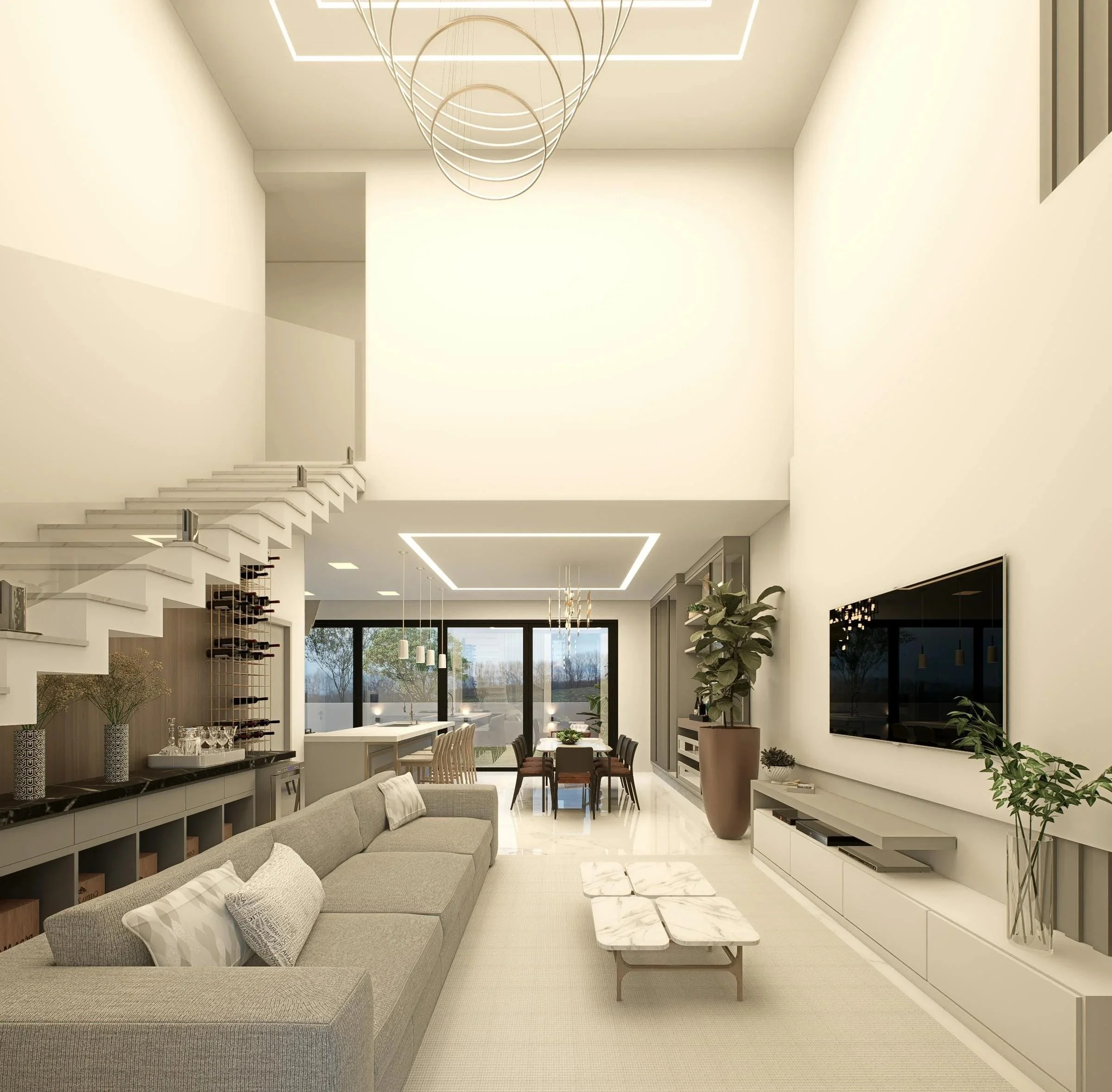 Modern open-concept living room with high ceilings, large TV mounted on wall, beige sofa, marble coffee table, and dining area in the background with large windows and outdoor view.