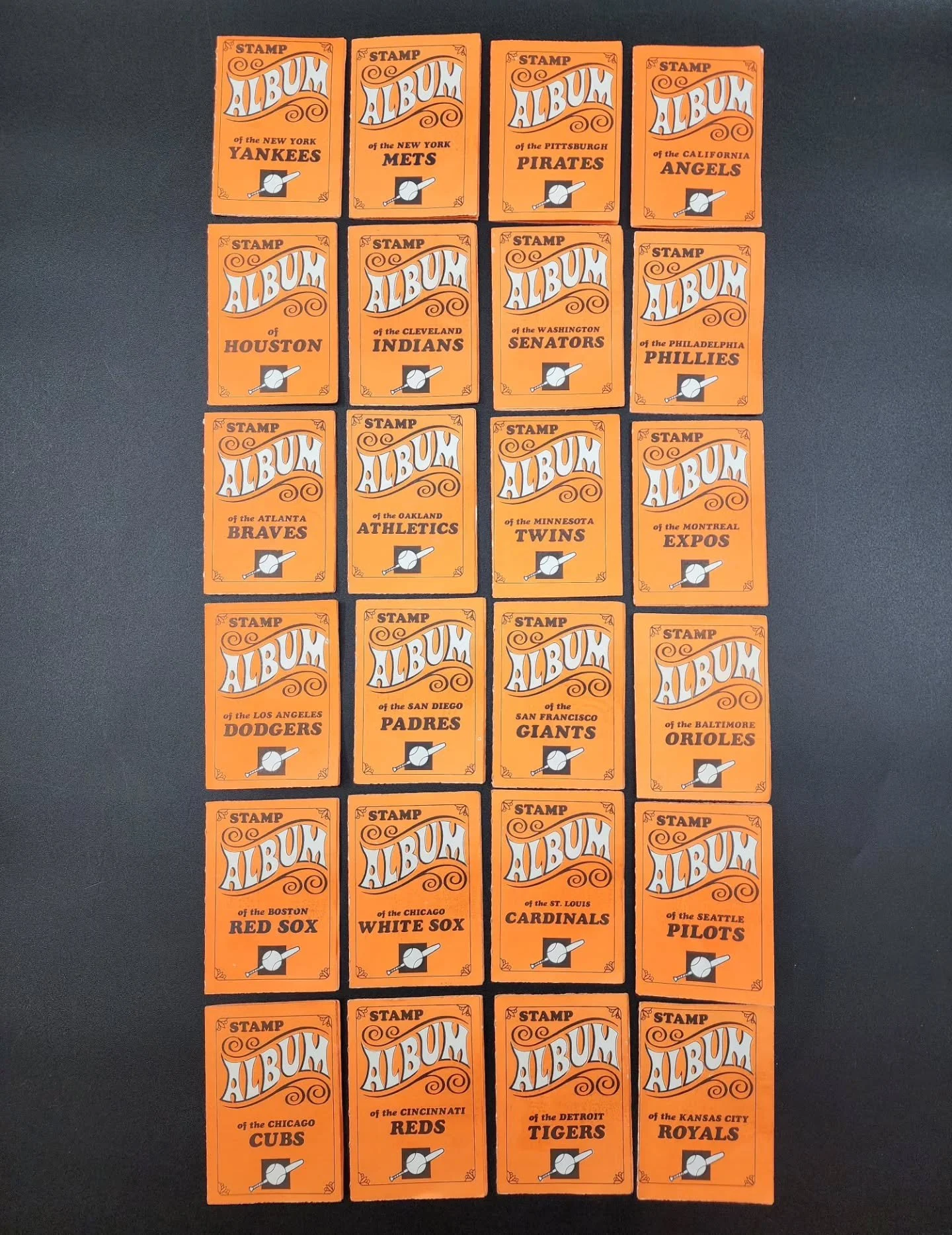 🧡 FOR SALE: Straight from 1969, these Topps MLB Stamp Albums are a time capsule of America&rsquo;s pastime. Each little orange booklet was made to hold 10 collectible player stamps&mdash;featuring teams from legends like the Yankees and Dodgers&hell
