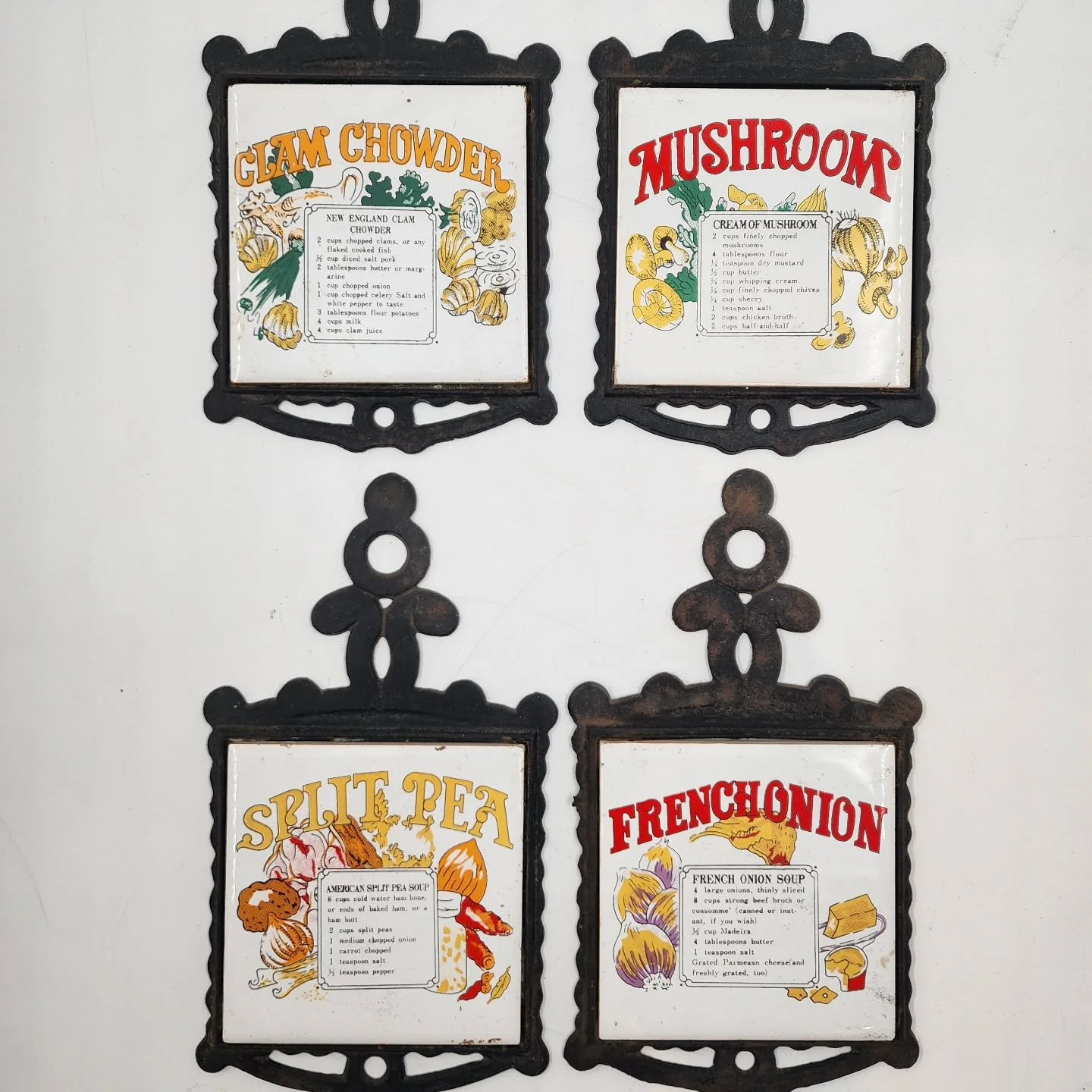 🍲 Before Pinterest boards and food blogs, recipes sometimes lived right on your kitchen wall! These cast-iron trivets with ceramic tiles double as d&eacute;cor and heat-safe stands for hot pots.

Each tile features a hand-illustrated recipe for clas