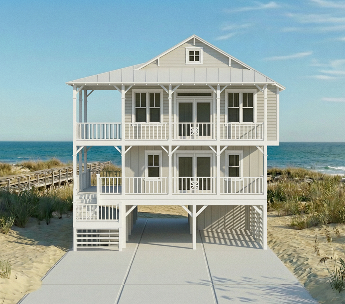 Three-story white beach house with balconies, located by the ocean, with a concrete driveway, sandy surroundings, and a clear blue sky.