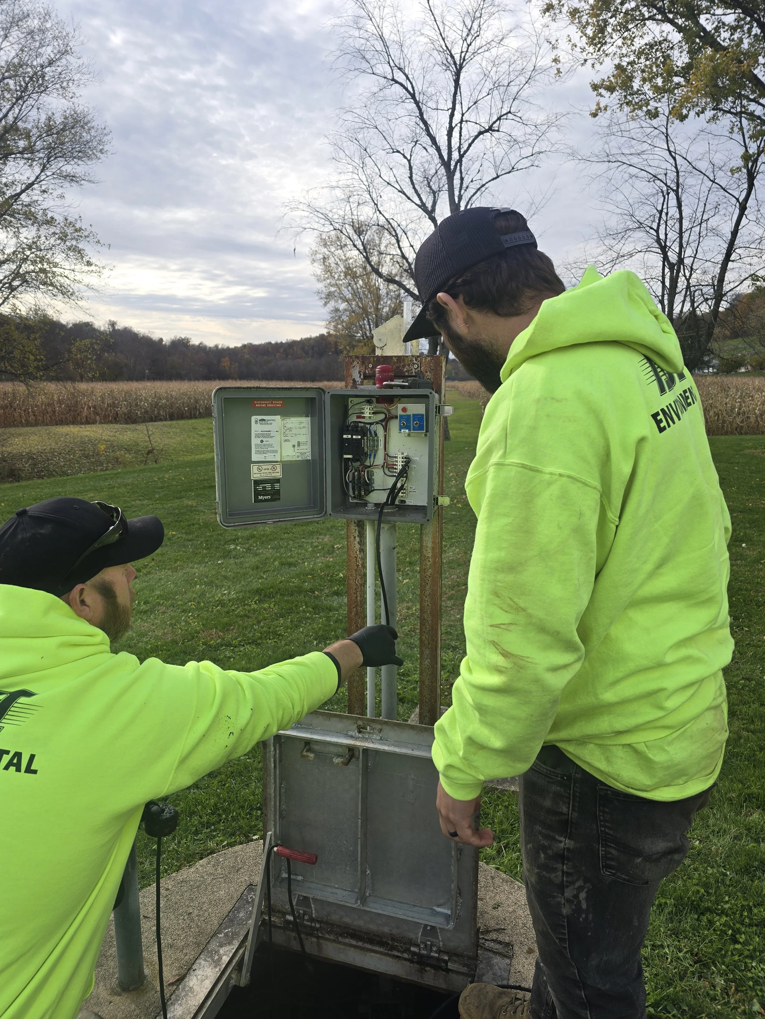 ASI commercial division service professional inspecting a control panel