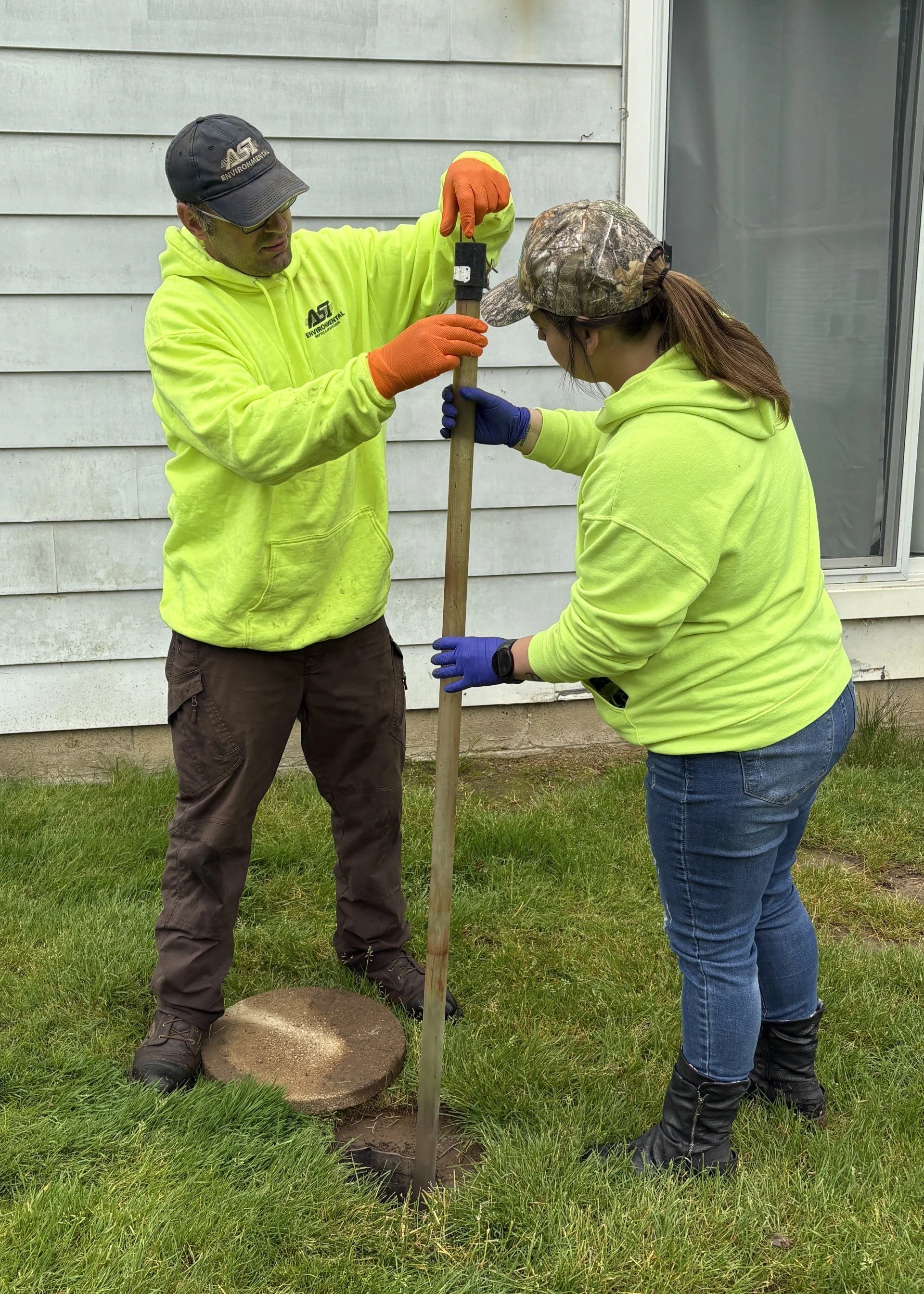 Aeration Septic Service Professional taking Sludge Judge sample