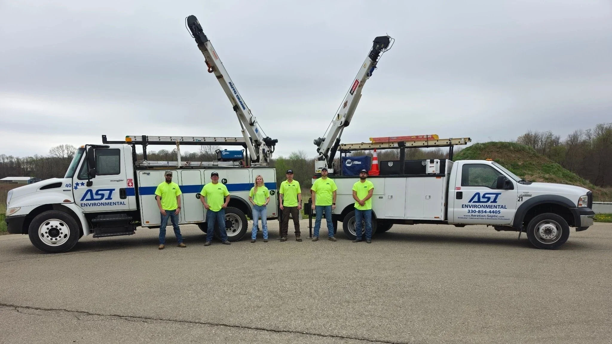 ASI commercial division service team in from of their service trucks