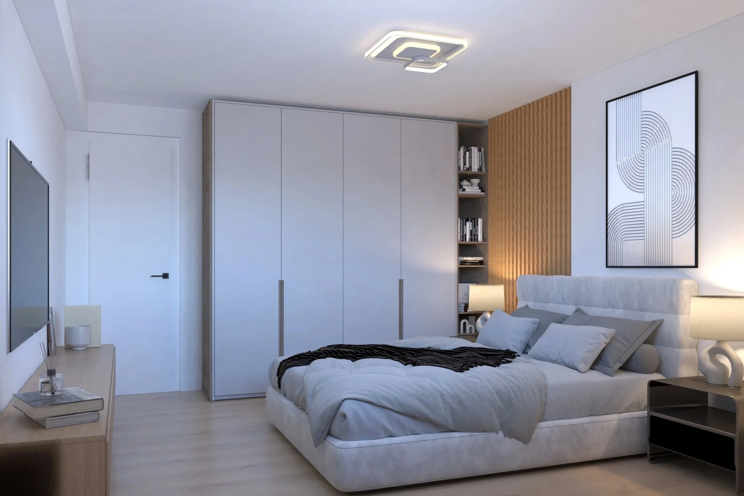Modern bedroom with a white bed, gray pillows, and a black-and-white wall art, illuminated by bedside lamps, with light wood flooring and built-in closet.