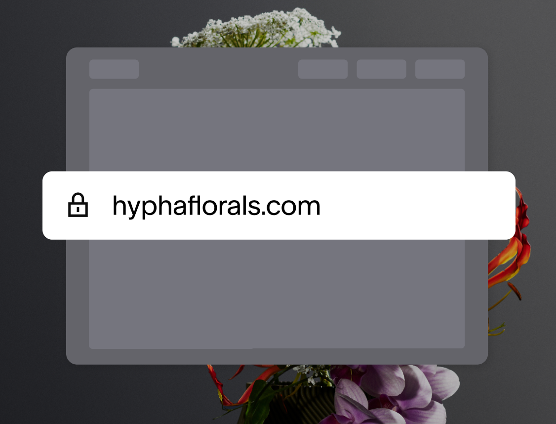 An enlarged browser search bar, with the URL hyphaflorals.com, over a browser window icon, set against a background of a floral arrangement.