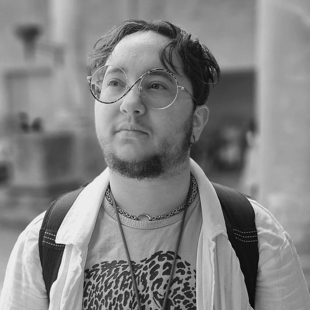 Billy stands looking off