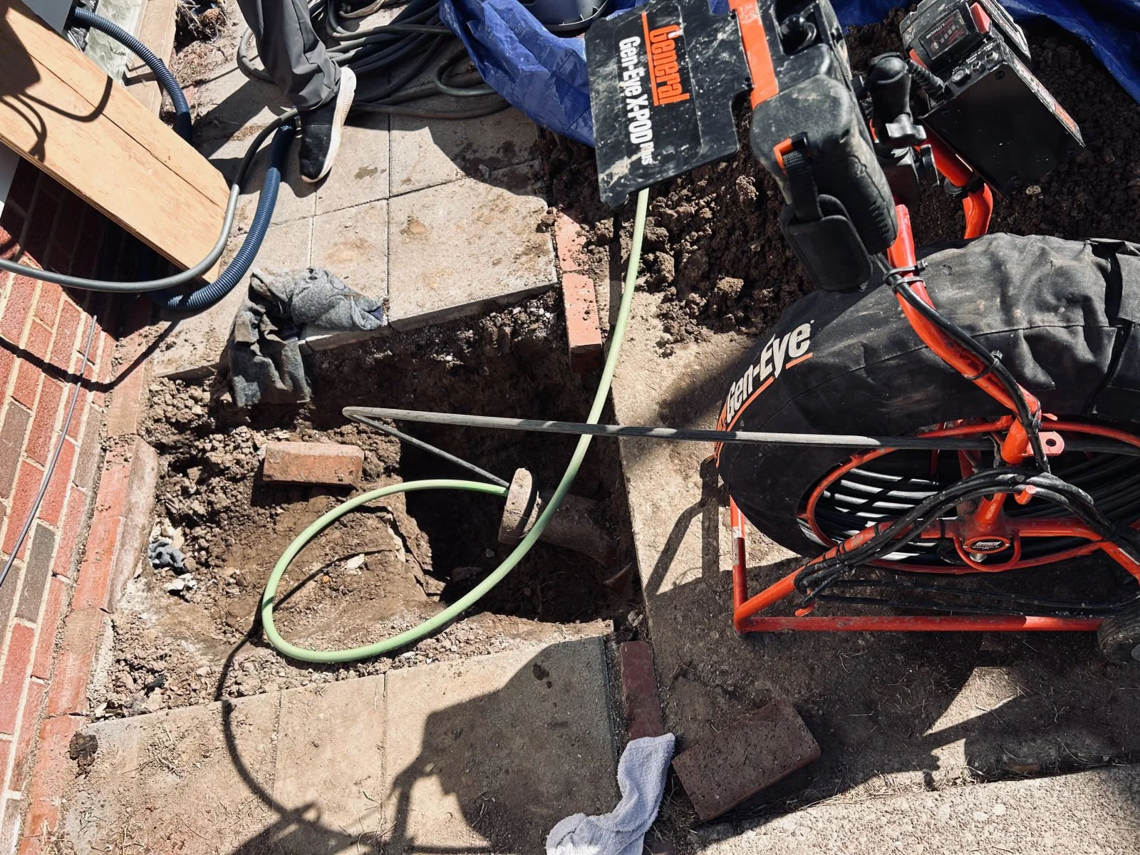Sewer camera inspection reel at an excavated cleanout