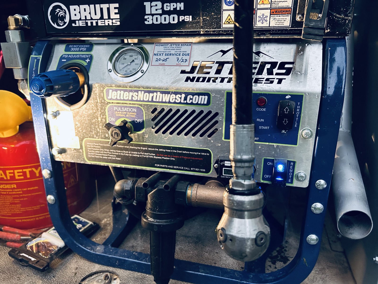 Hydro jetter with a jetting nozzle attached to the hose