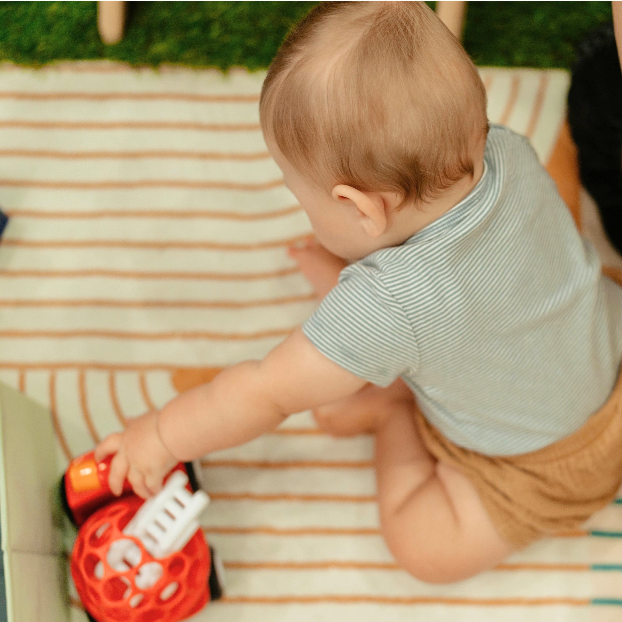 Baby exploring during Belly Babies at Pitter-Patter Play