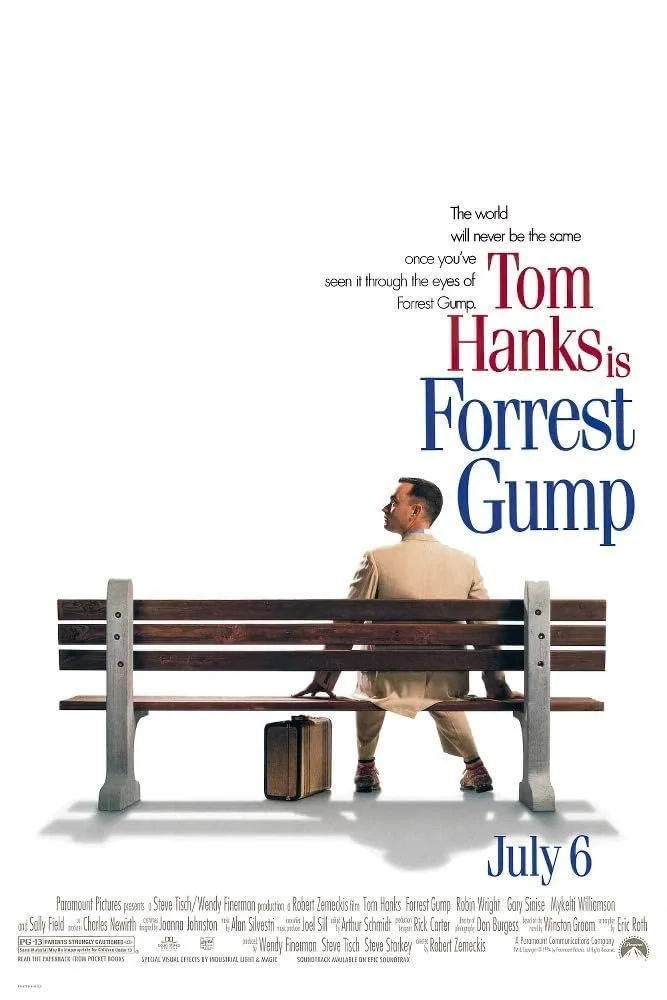 Poster for the movie 'Forrest Gump' featuring a man in a beige suit sitting on a wooden park bench with a suitcase at his feet. The text indicates release date July 6 and mentions Tom Hanks.