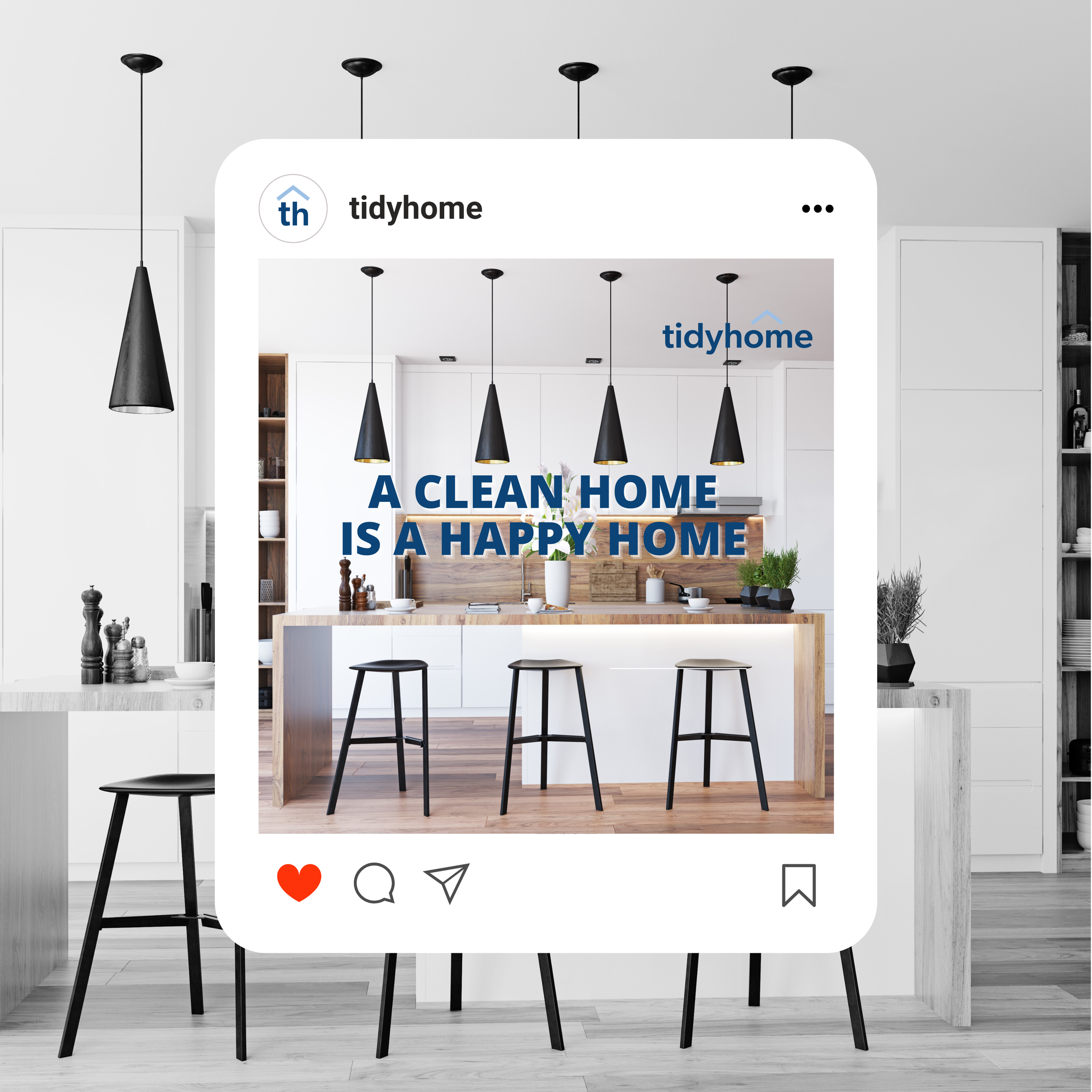 Instagram post from tidyhome showing a modern kitchen with a wooden island, black pendant lights, and white cabinets, with the text 'A clean home is a happy home' overlayed.